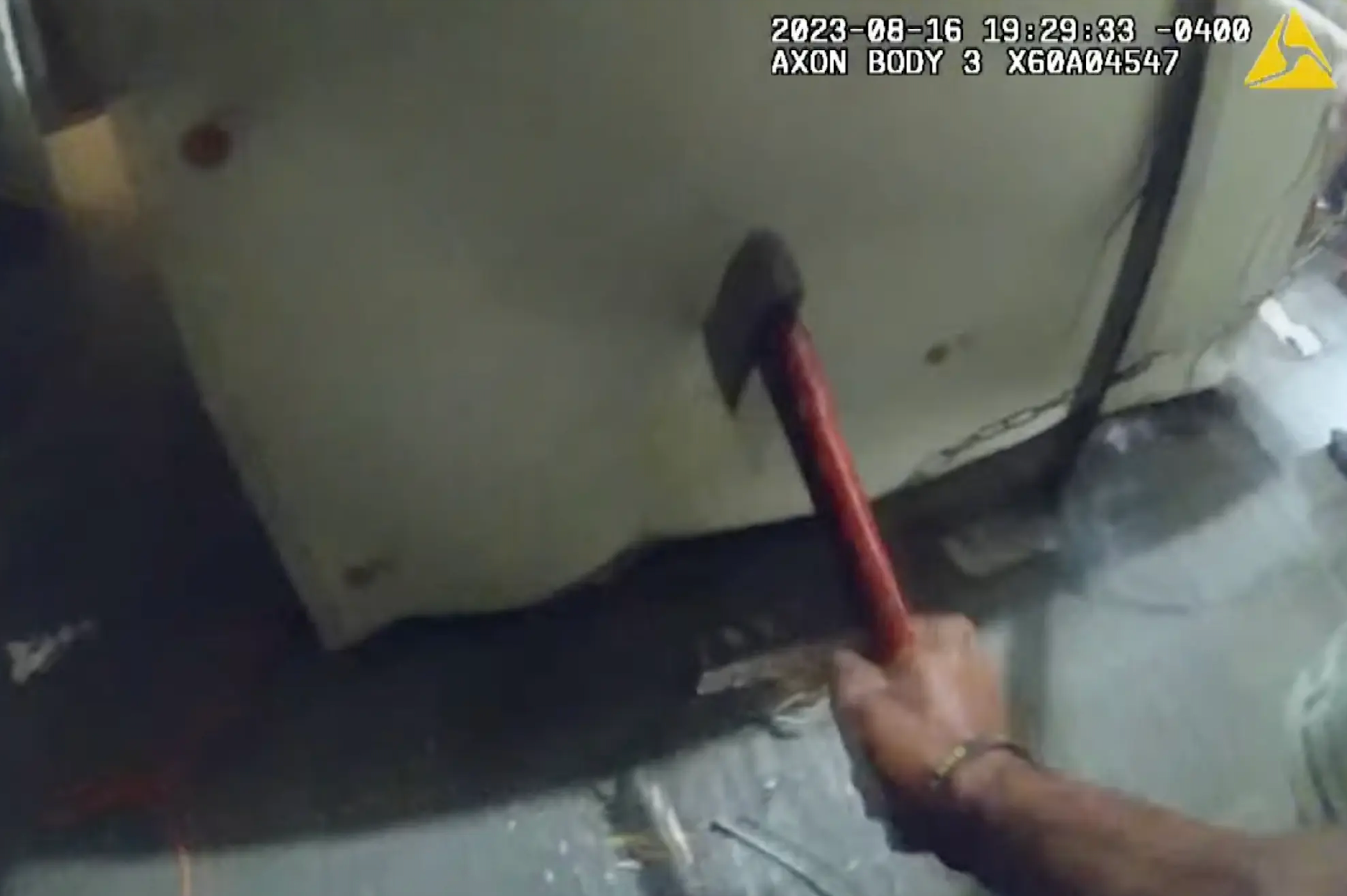 Police found a hatchet and were able to cut the chain that was holding the woman to the floor