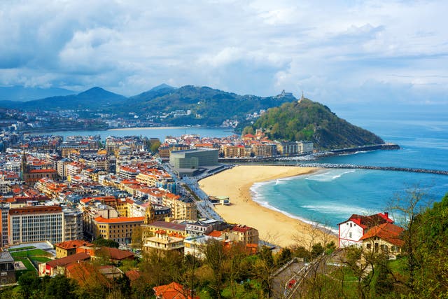 <p>Golden sand and green hillsides border San Sebastian</p>