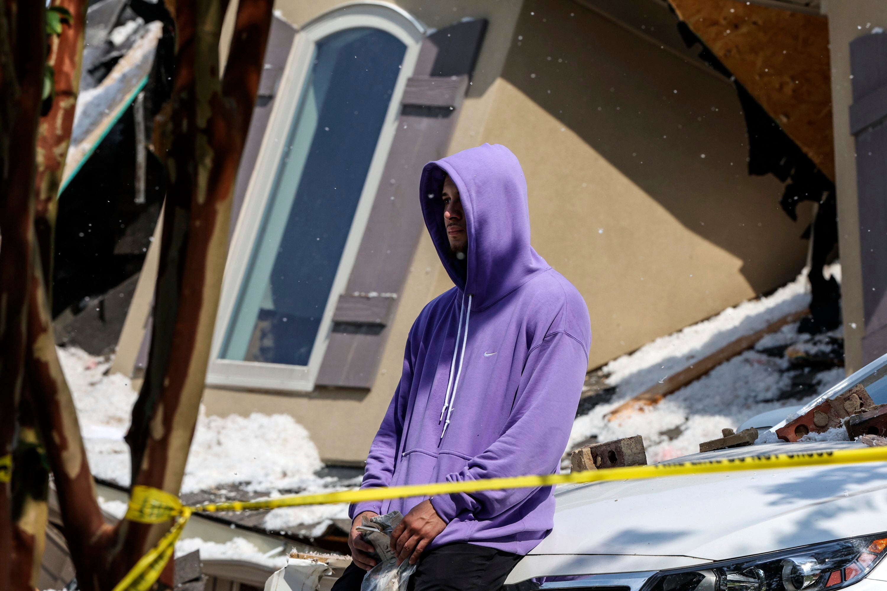 Tennessee Titans cornerback Caleb Farley sits outside of the rubble of his home after an explosion in Mooresville, N.C., Tuesday, Aug. 22, 2023.