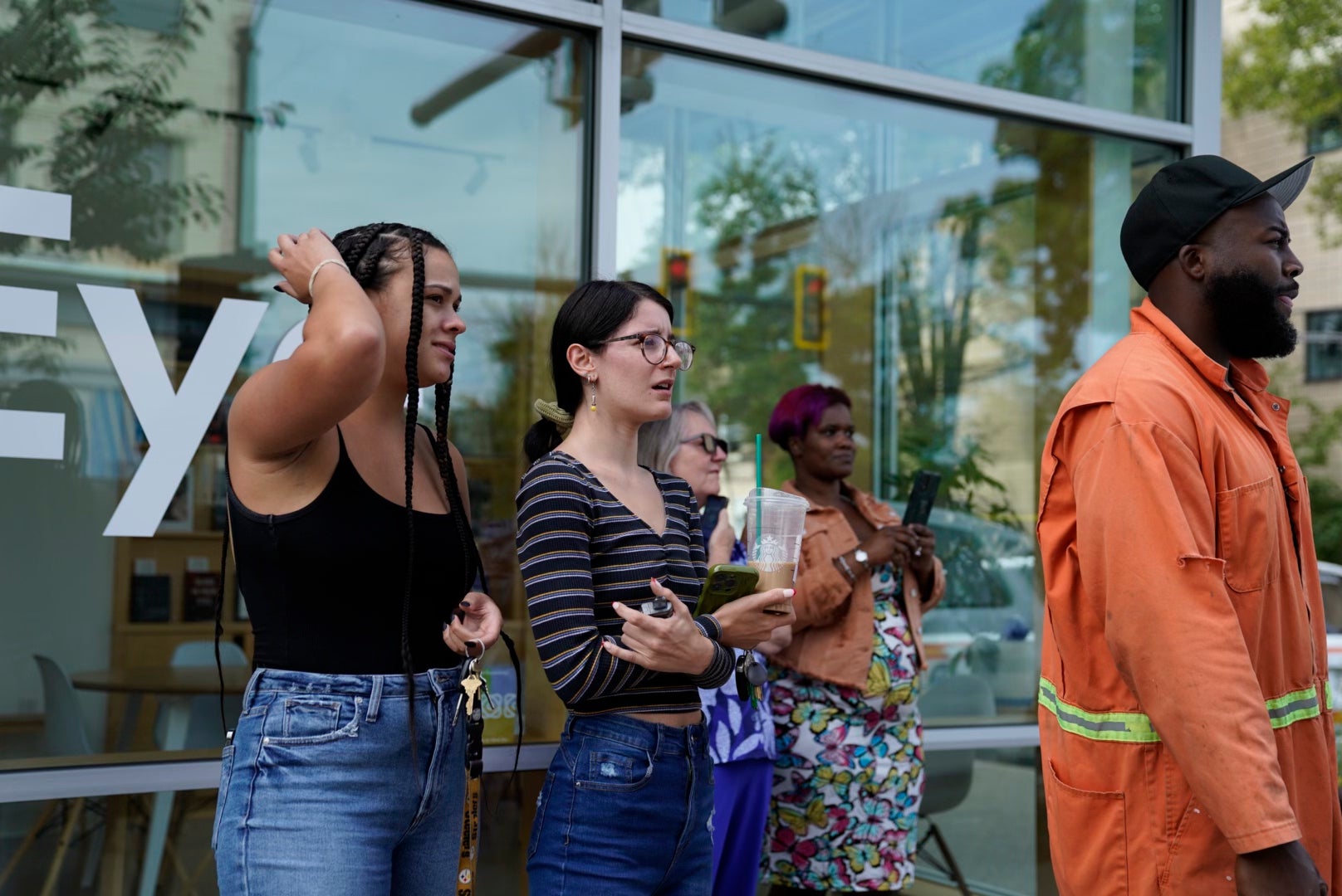 Bystanders watch as Pittsburgh police and other law enforcement personal respond to gunfire