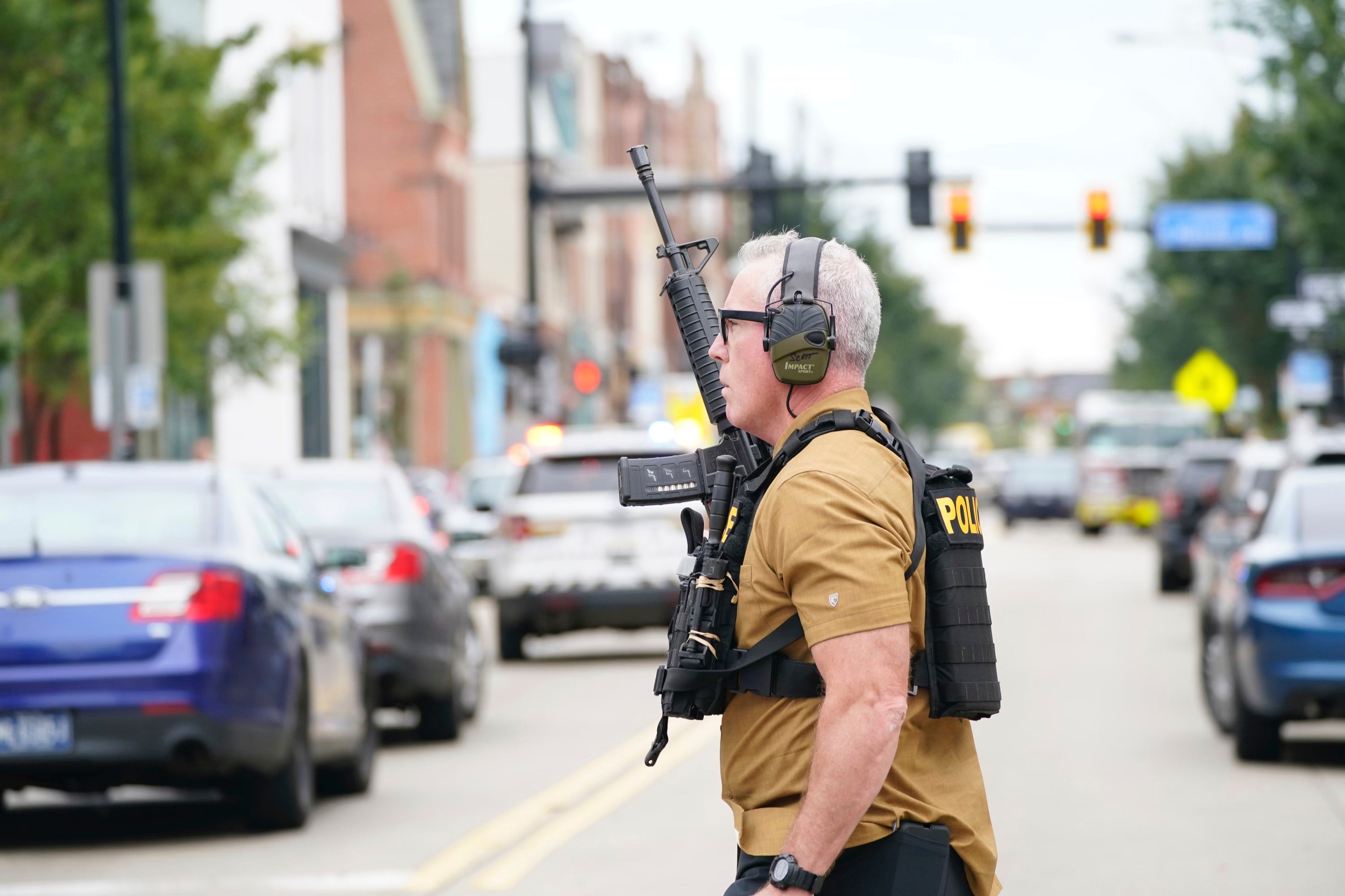 A law enforcement officer responds to gunfire