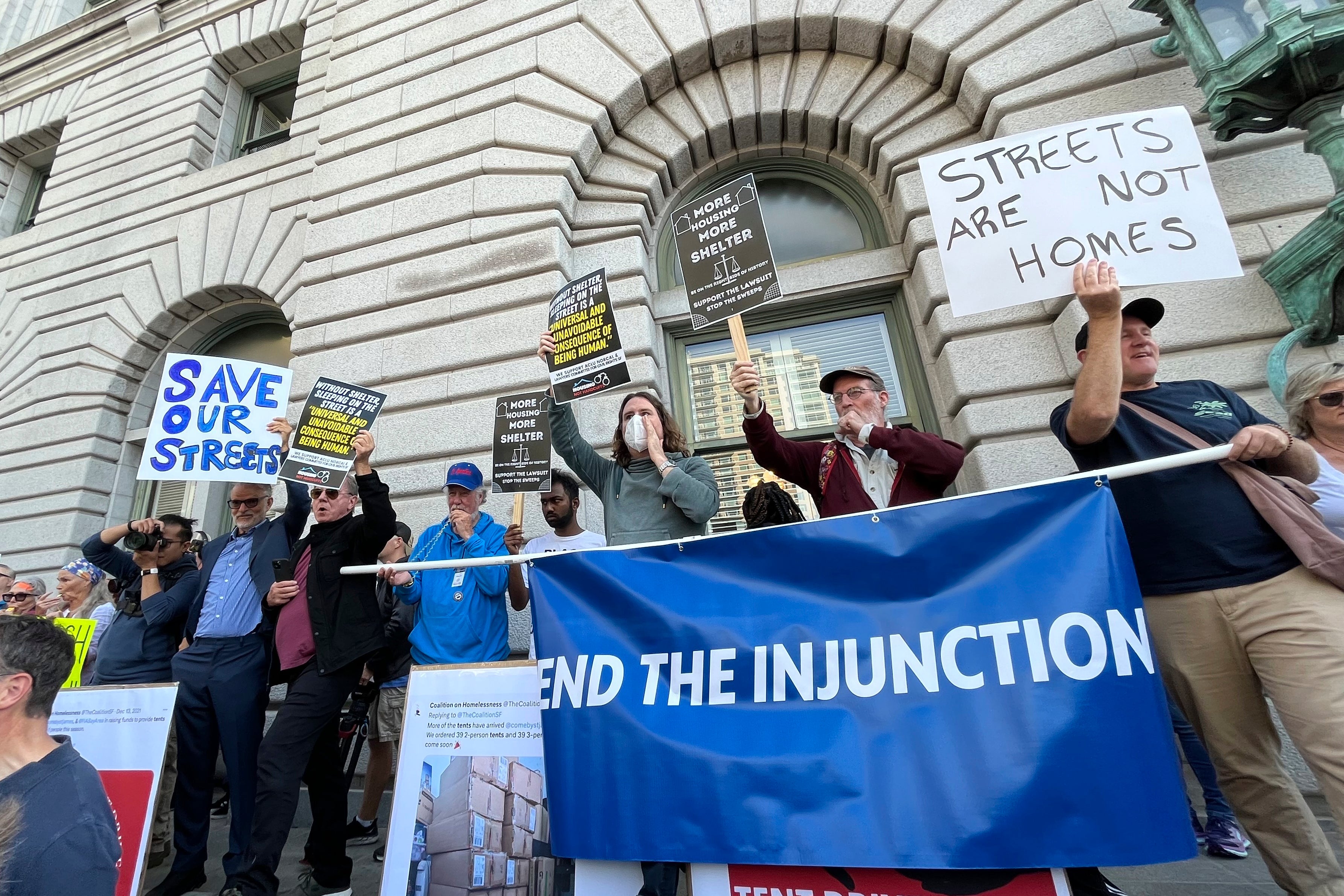 Residents and business leaders opposed to a federal judge's December order halting encampment sweeps rally before an appellate court hearing in San Francisco, Wednesday, Aug. 23, 2023