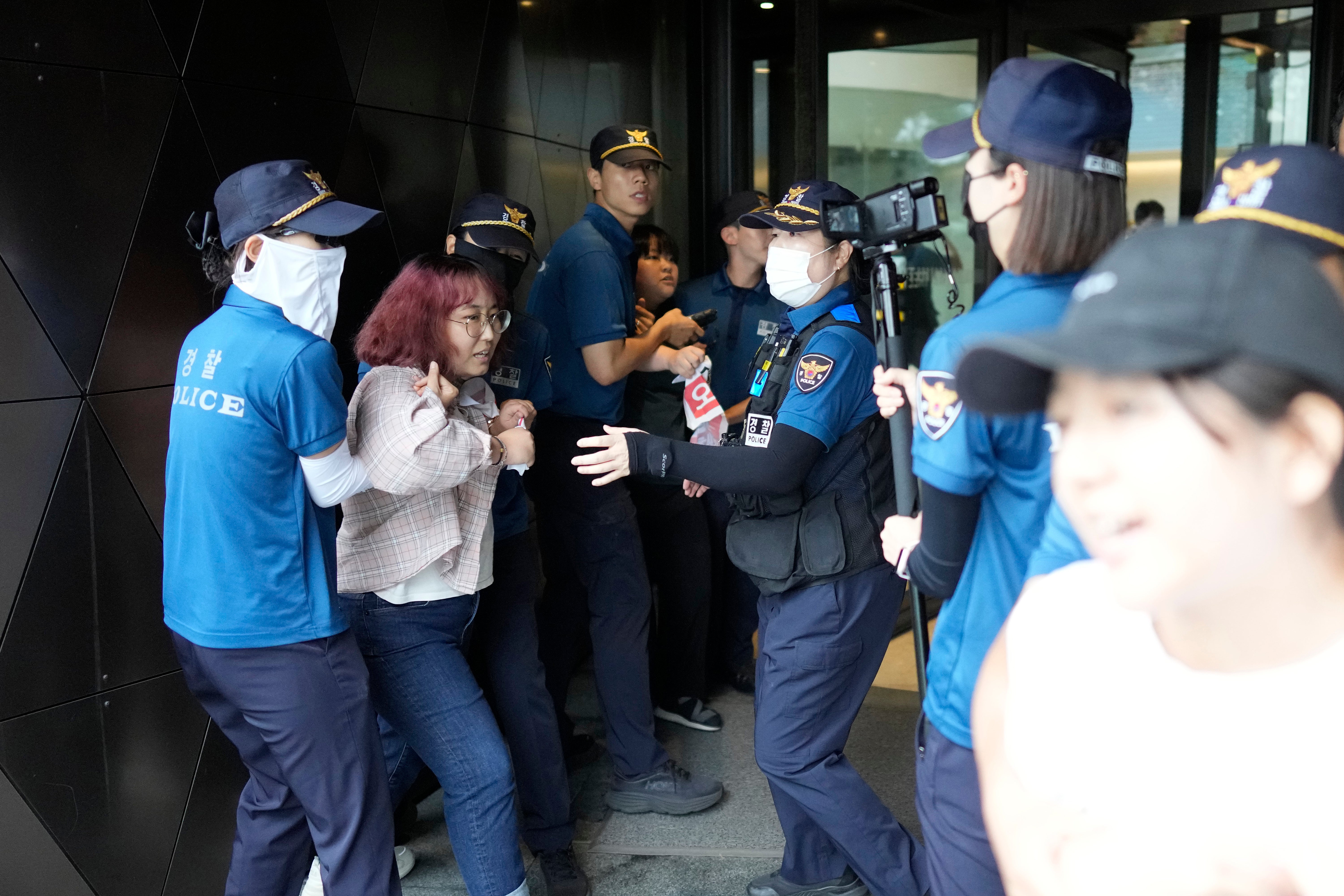 South Korean police detain protesters outside the Japanese embassy in Seoul