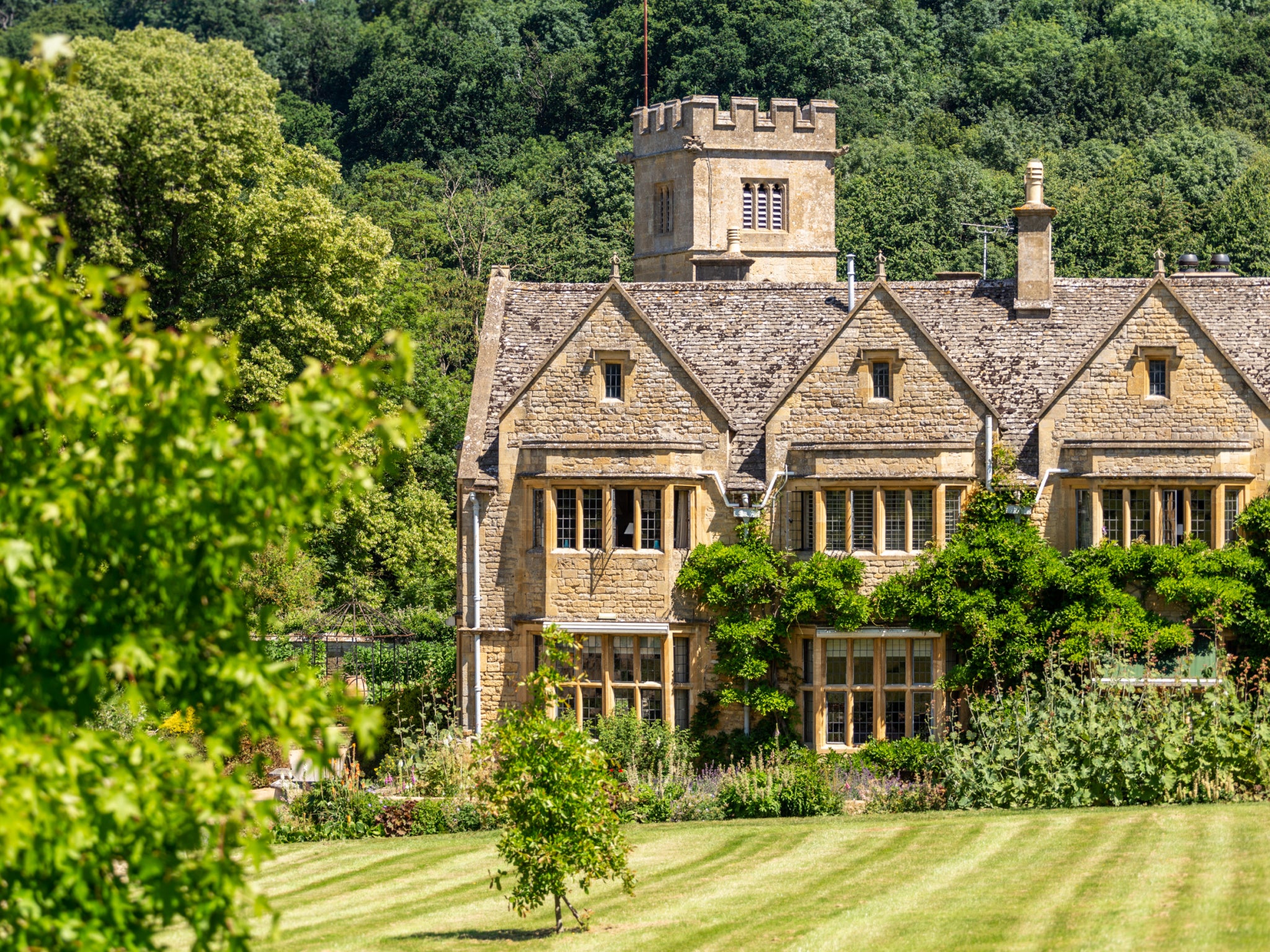 This idyllic manor house is backed by 10 acres of beautifully kept gardens