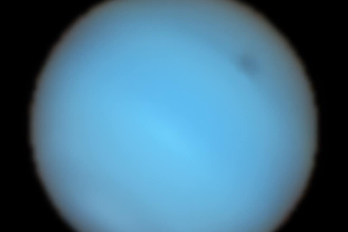 astronomers have seen a large dark spot in Neptune’s atmosphere (P Irwin et al/ESO/PA)