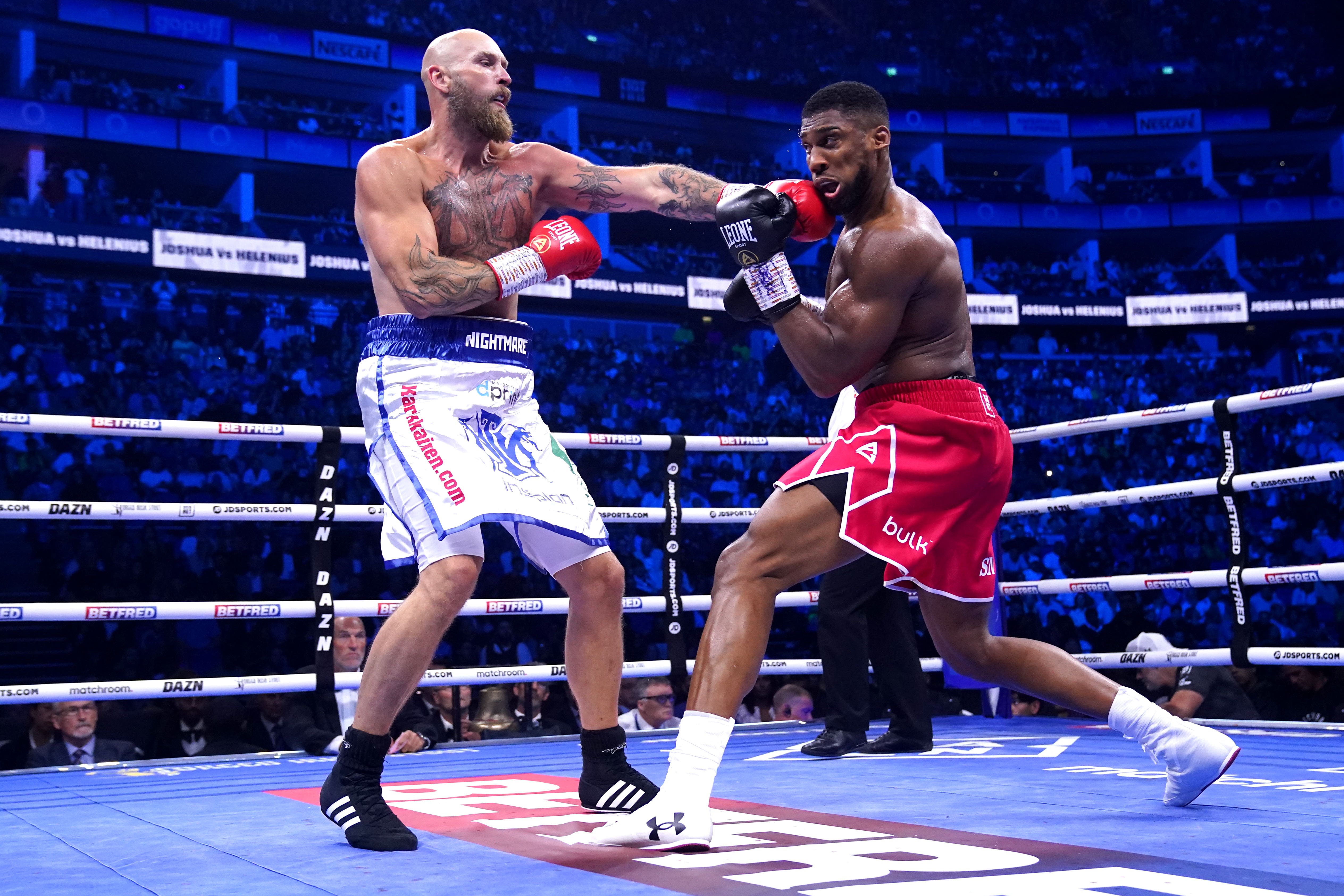 Joshua, right, during his knockout win over Robert Helenius in August