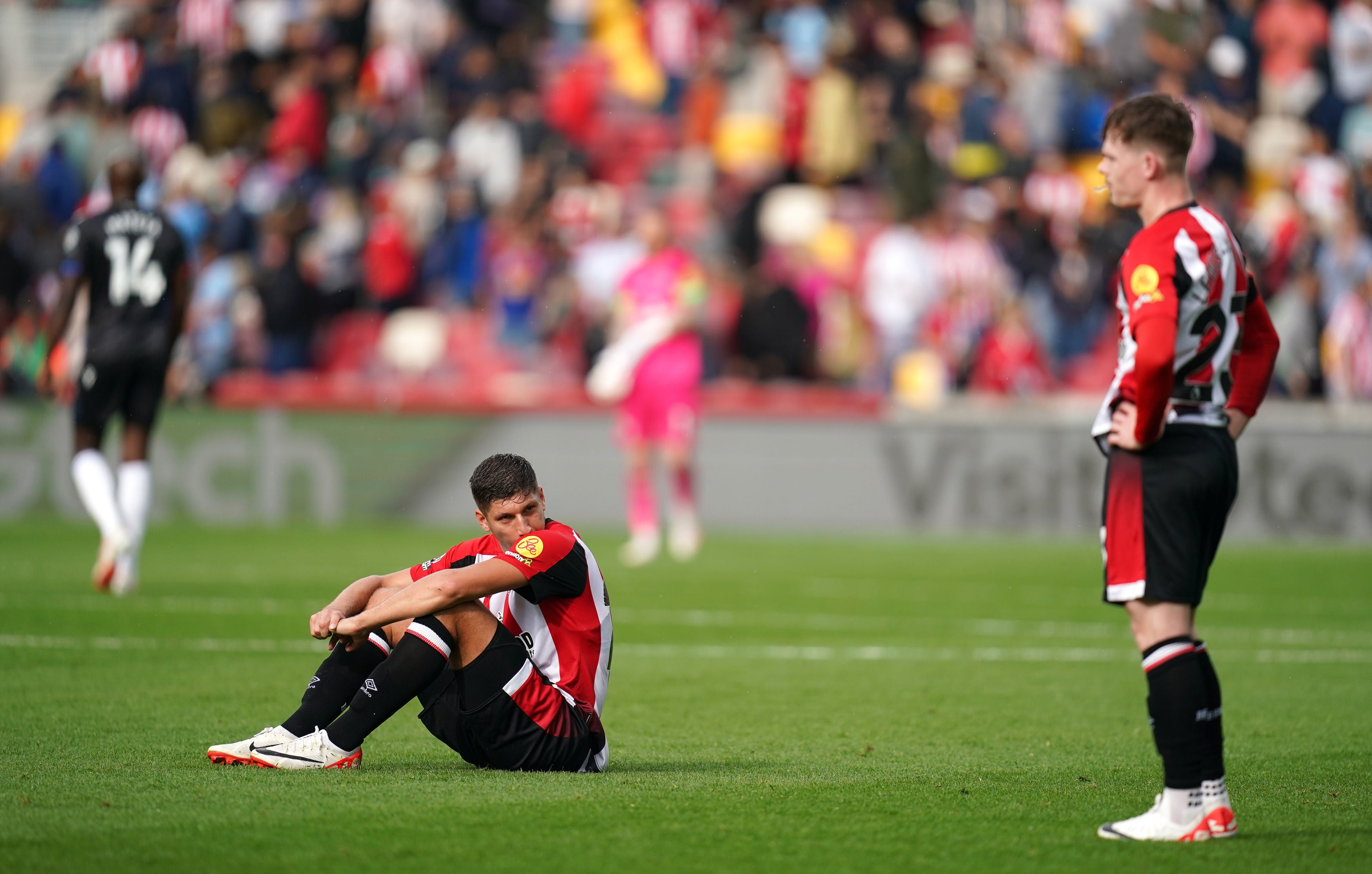 Brentford's Vitaly Janelt (left) and Brentford's Keane Lewis-Potter react after the Premier League match at the Gtech Community Stadium, London