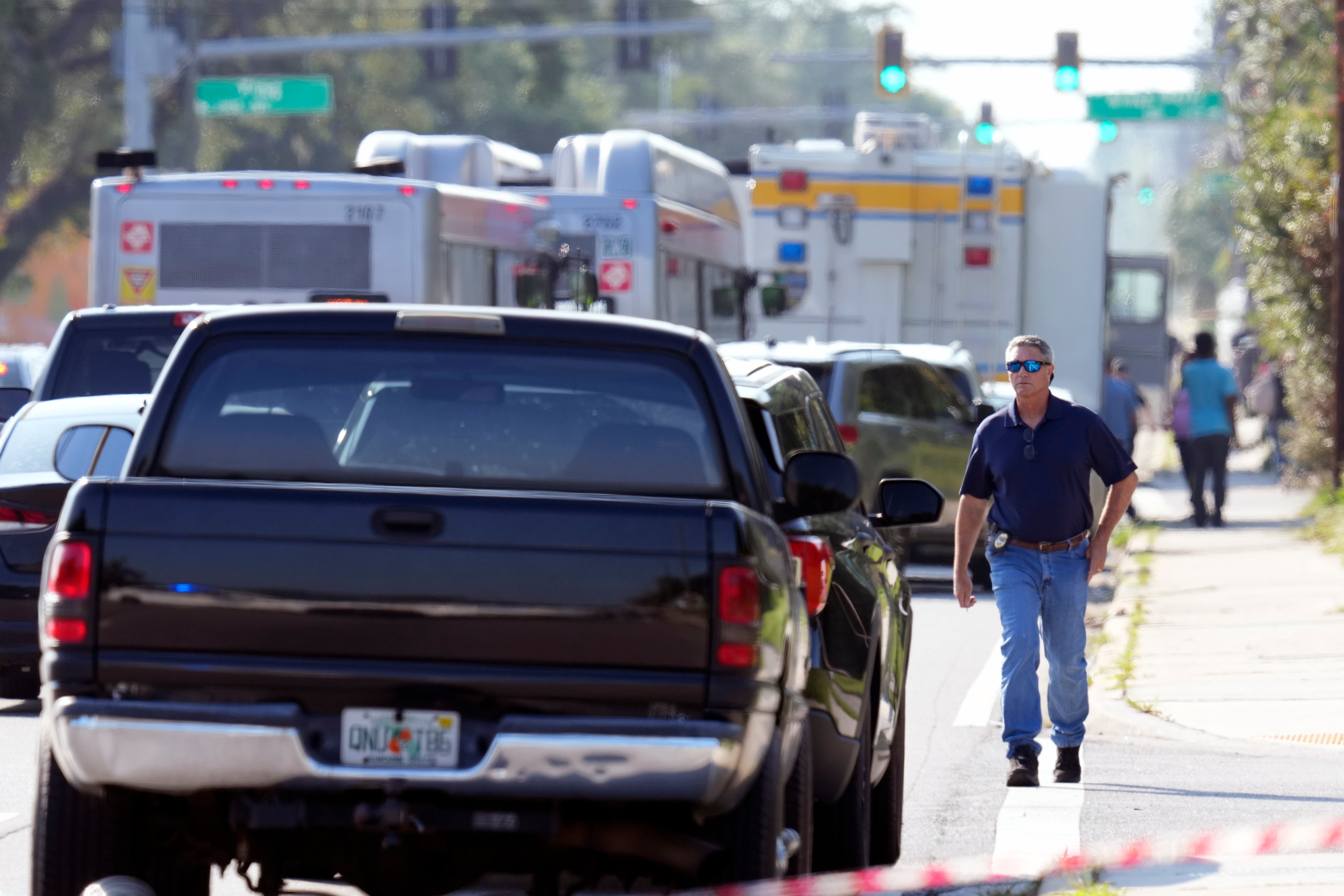 Police investigate the scene of a mass shooting, Saturday, Aug. 26, 2023, in Jacksonville, Fla.