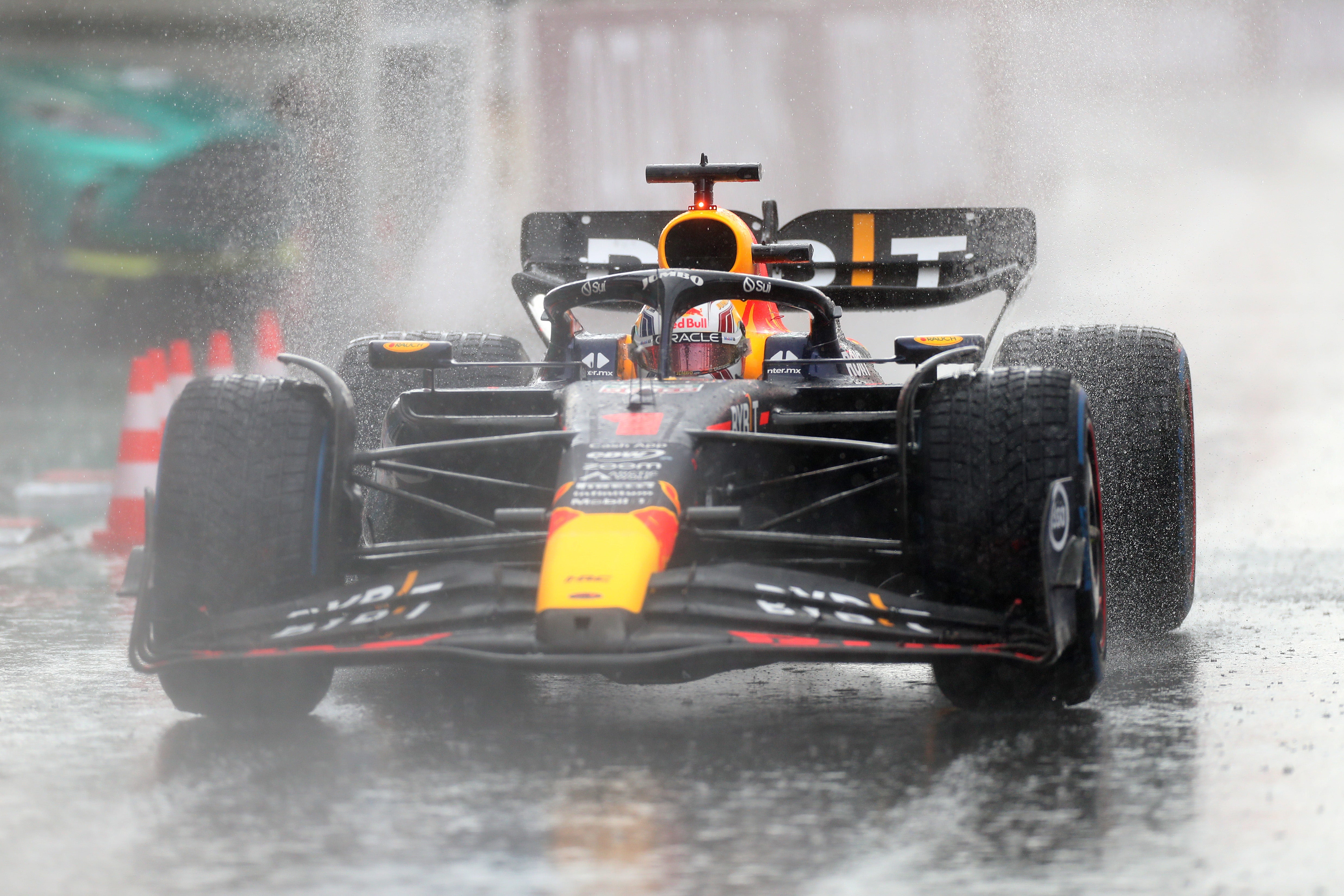 Max Verstappen survived damp conditions to win his home race in Zandvoort