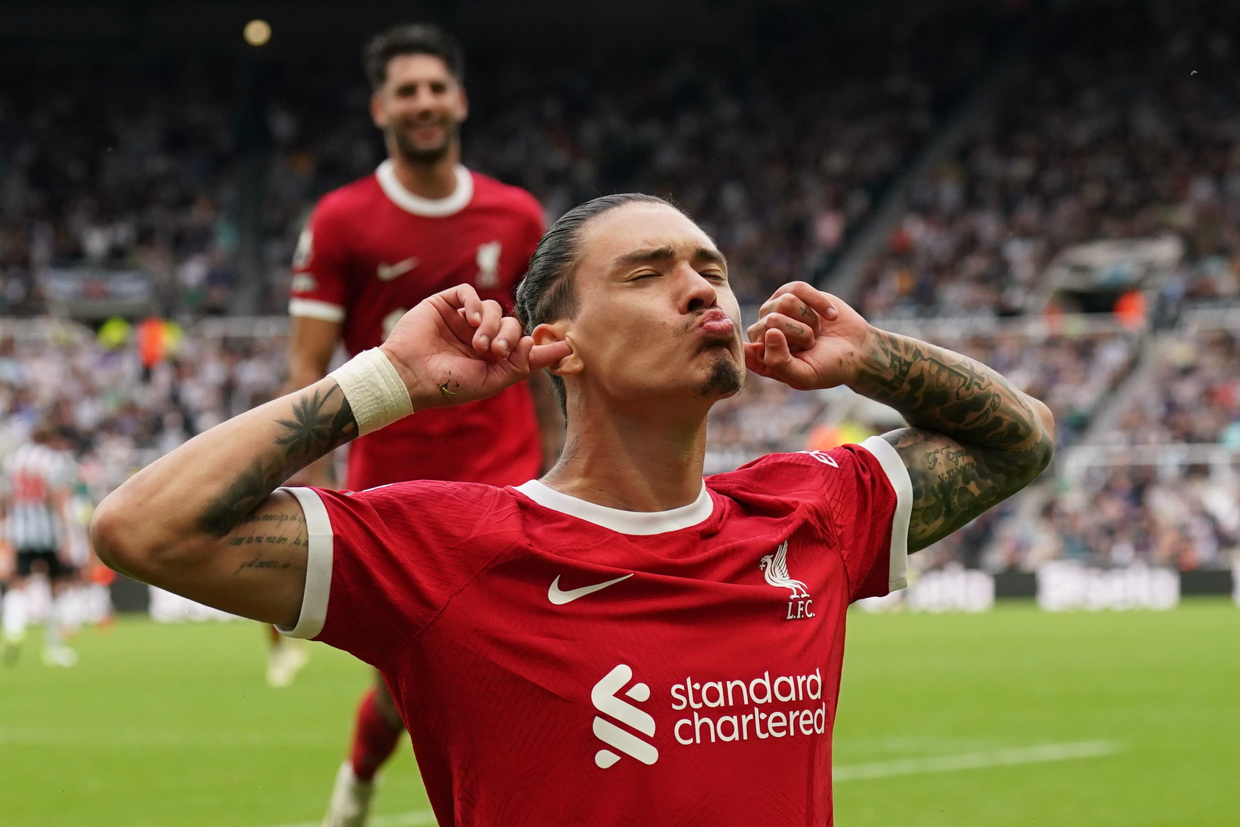 Darwin Nunez scored twice to earn 10-man Liverpool an unlikely victory over Newcastle (Owen Humphreys/PA)