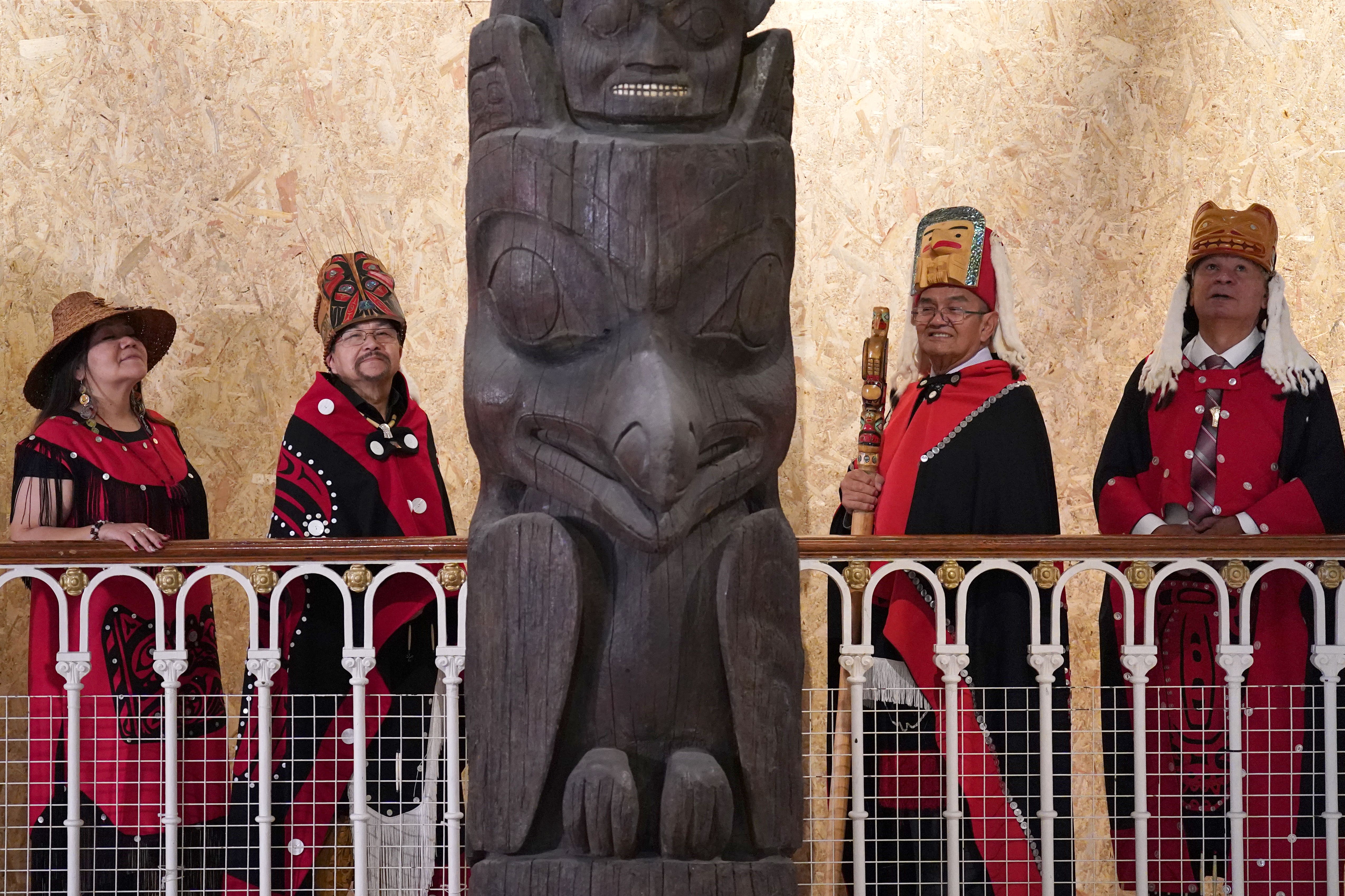 Delegates from the Nisga’a nation with the totem pole in Edinburgh (Andrew Milligan/PA)