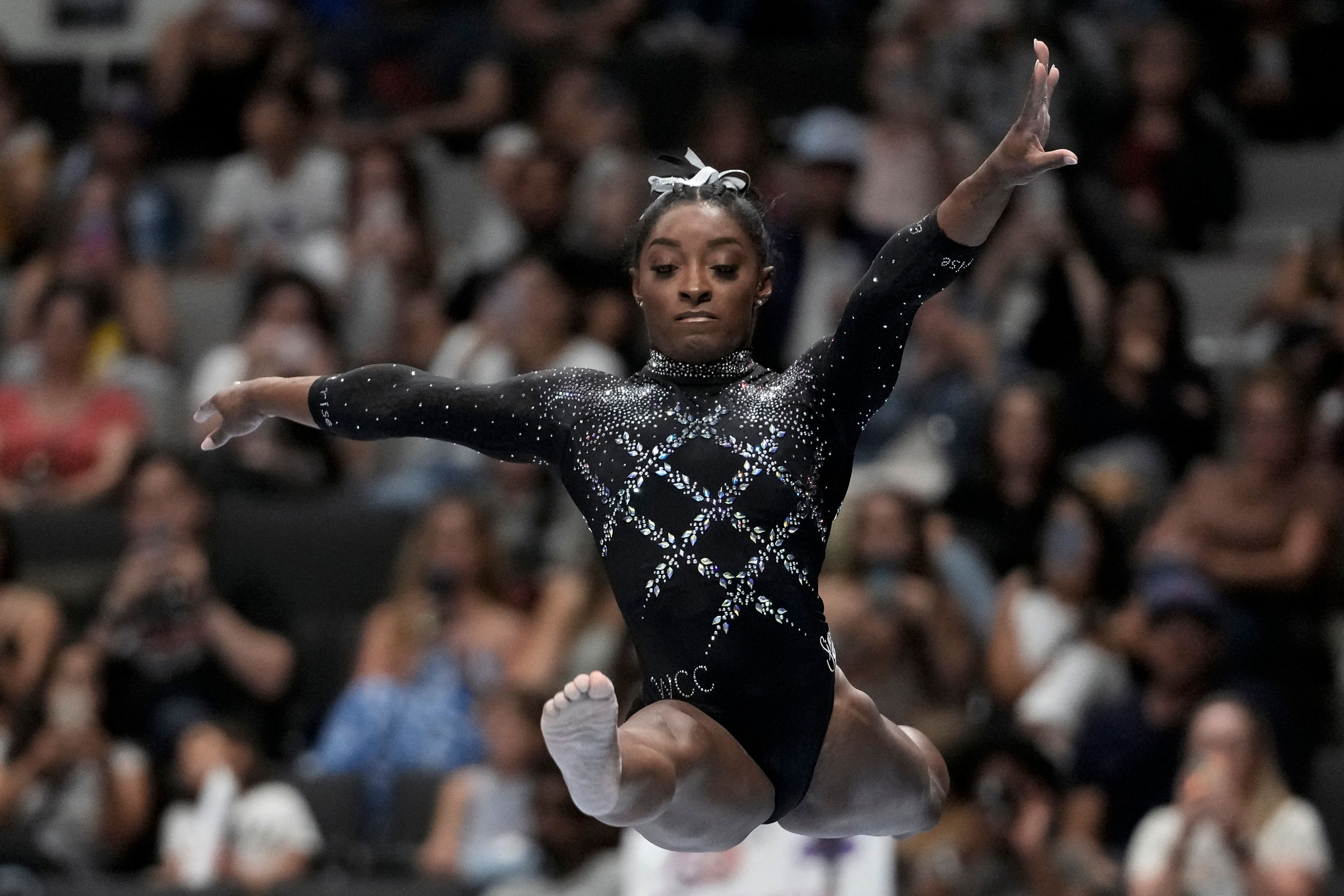 Simone Biles competes on the beam during the U.S. Gymnastics Championships on Sunday (Godofredo A. V-squez/AP)