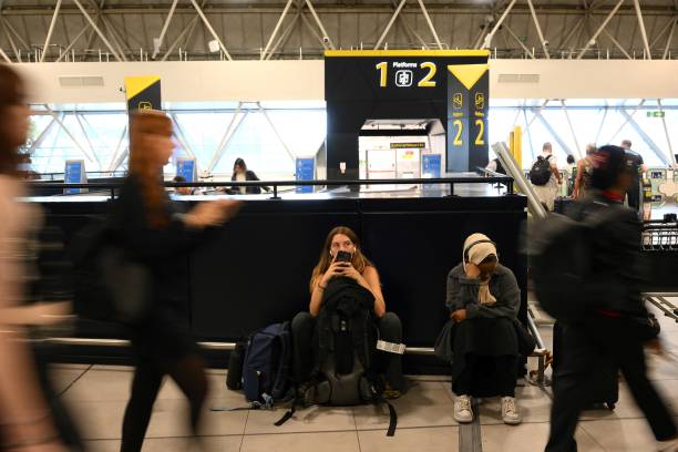 Waiting game: travellers at Gatwick airport the day after the Nats failure