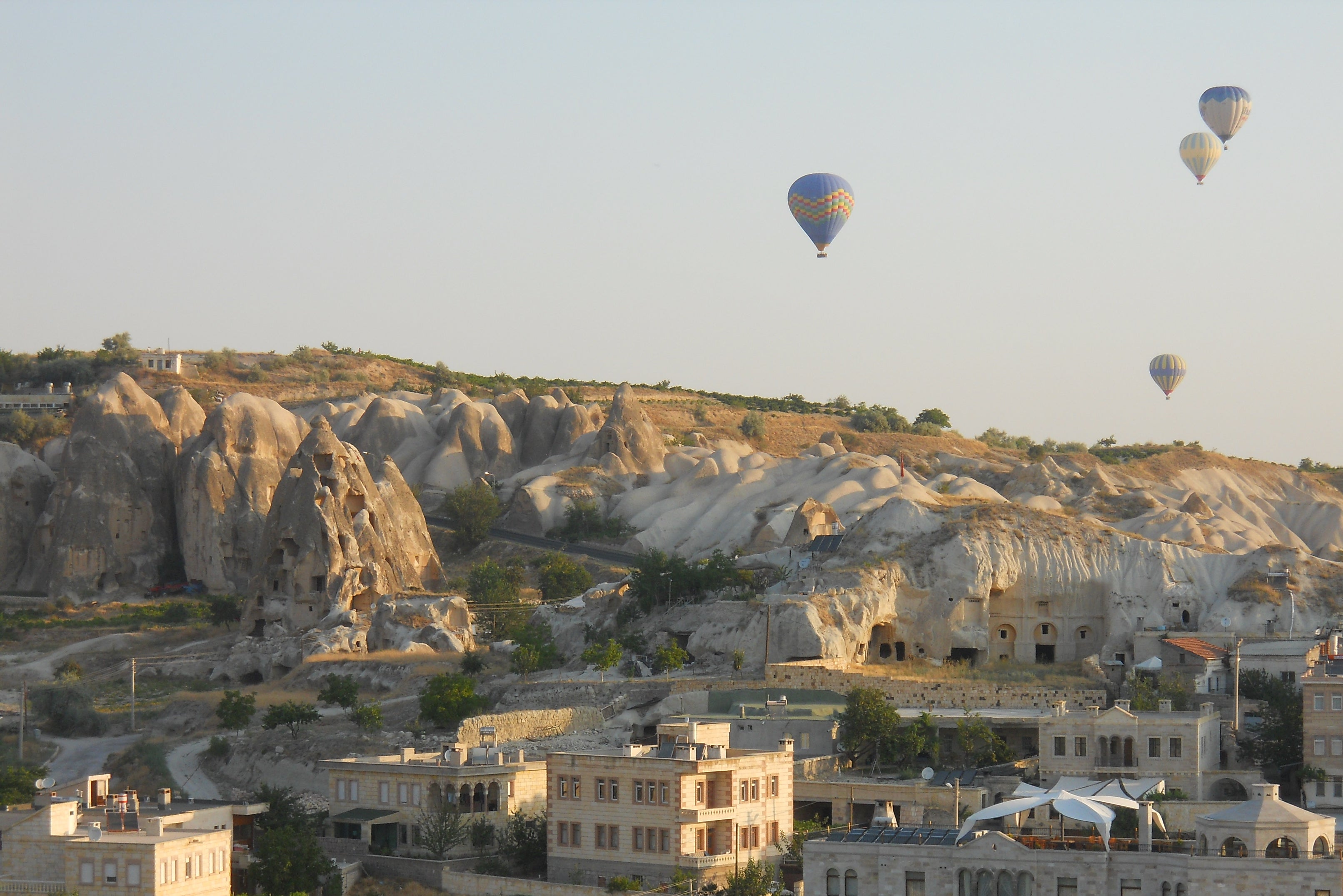 Colourful hot air balloons can be seen across the sky