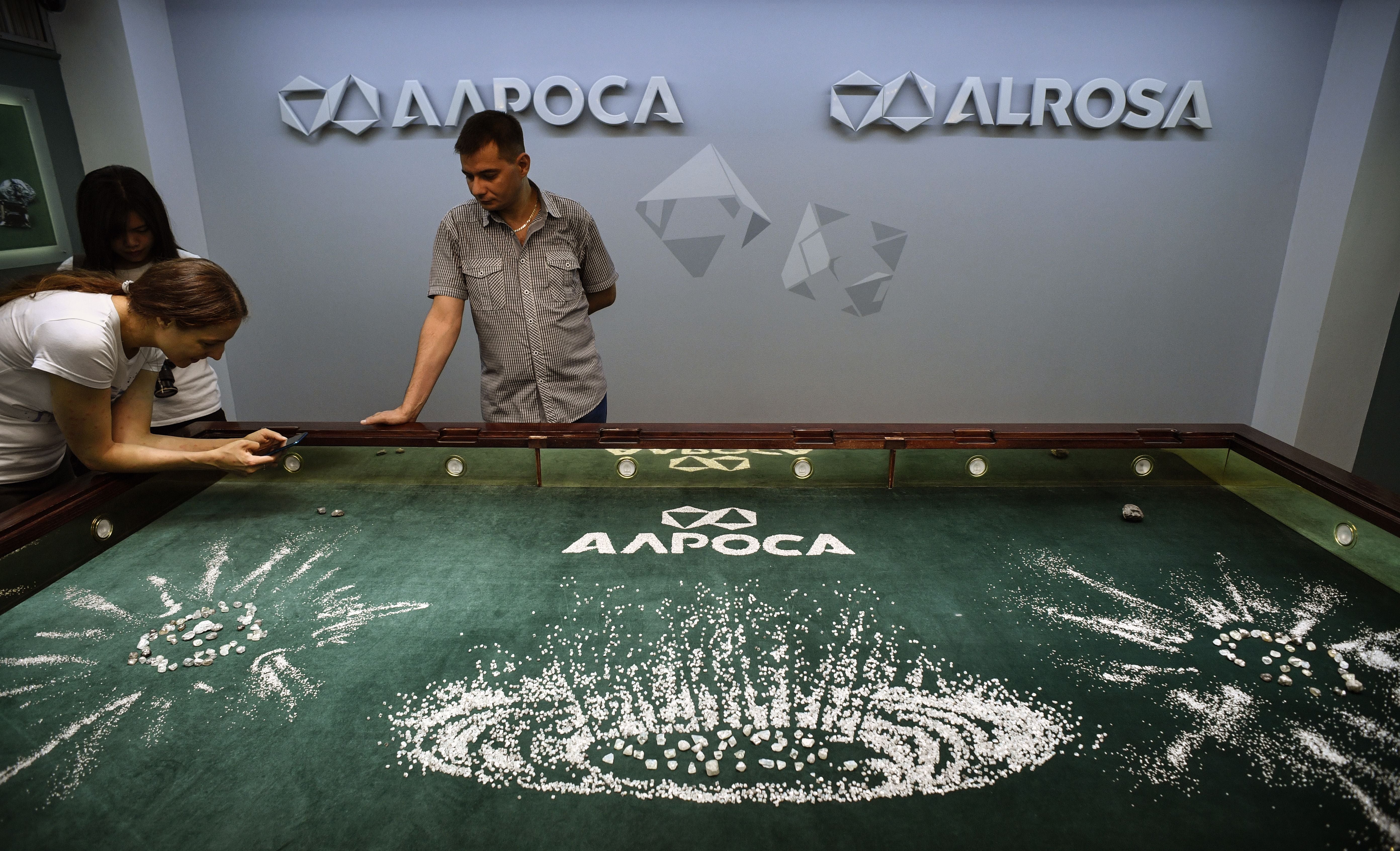 File photo: Visitors inspect a composition of 14.000 carats of rough diamonds worthing around USD 9 million in Alrosa Diamond Sorting Center in the town of Mirny