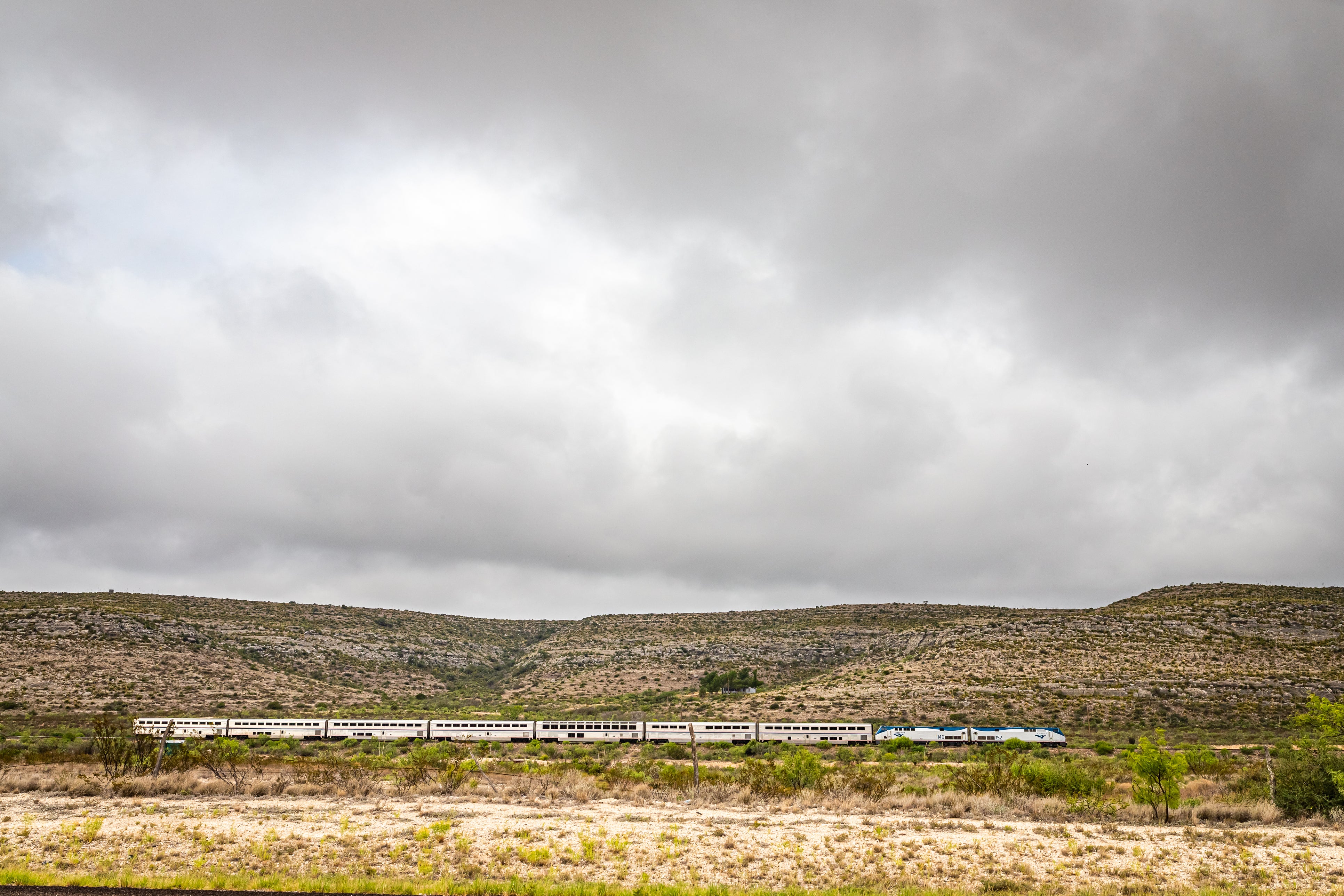 The Amtrak Sunset Limited train travels through the desert near Sanderson, Texas