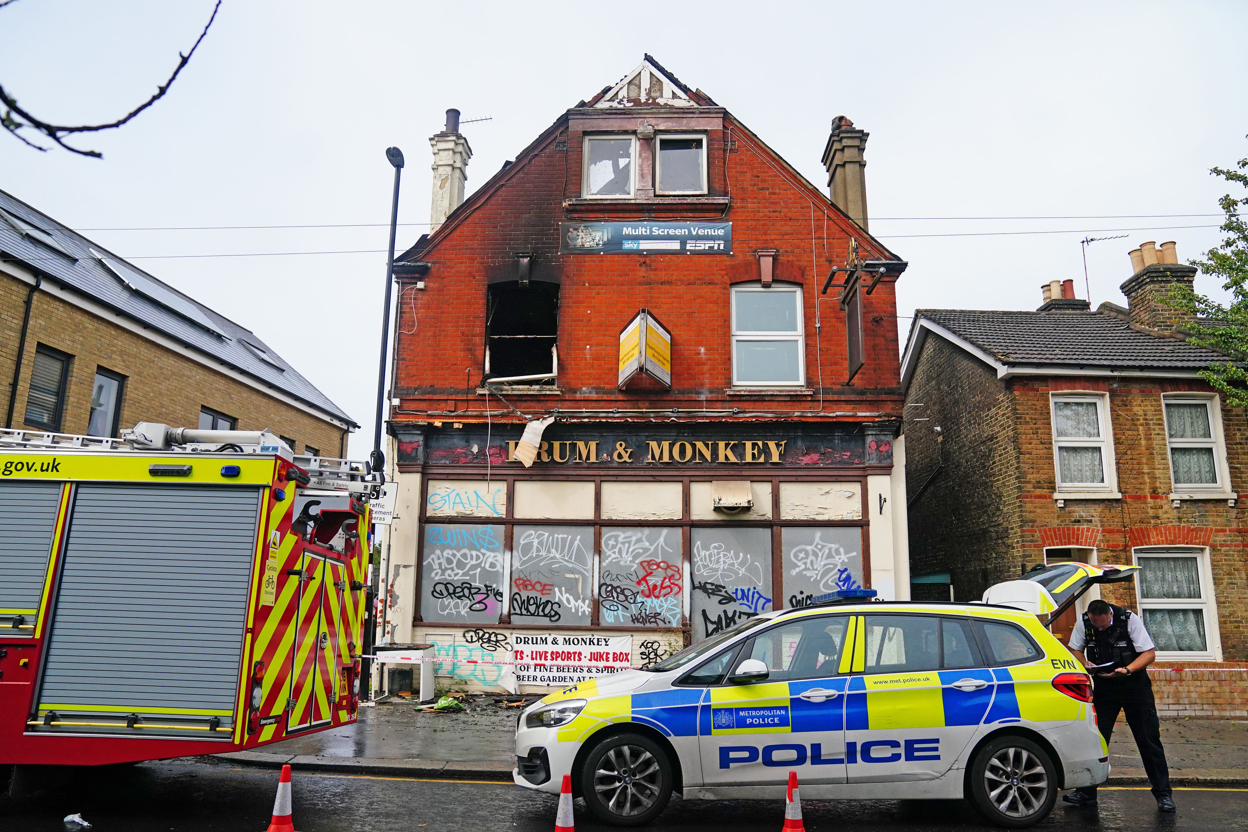 Emergency services attend a fire at the Drum & Monkey pub in Gloucester Road in Croydon (PA)