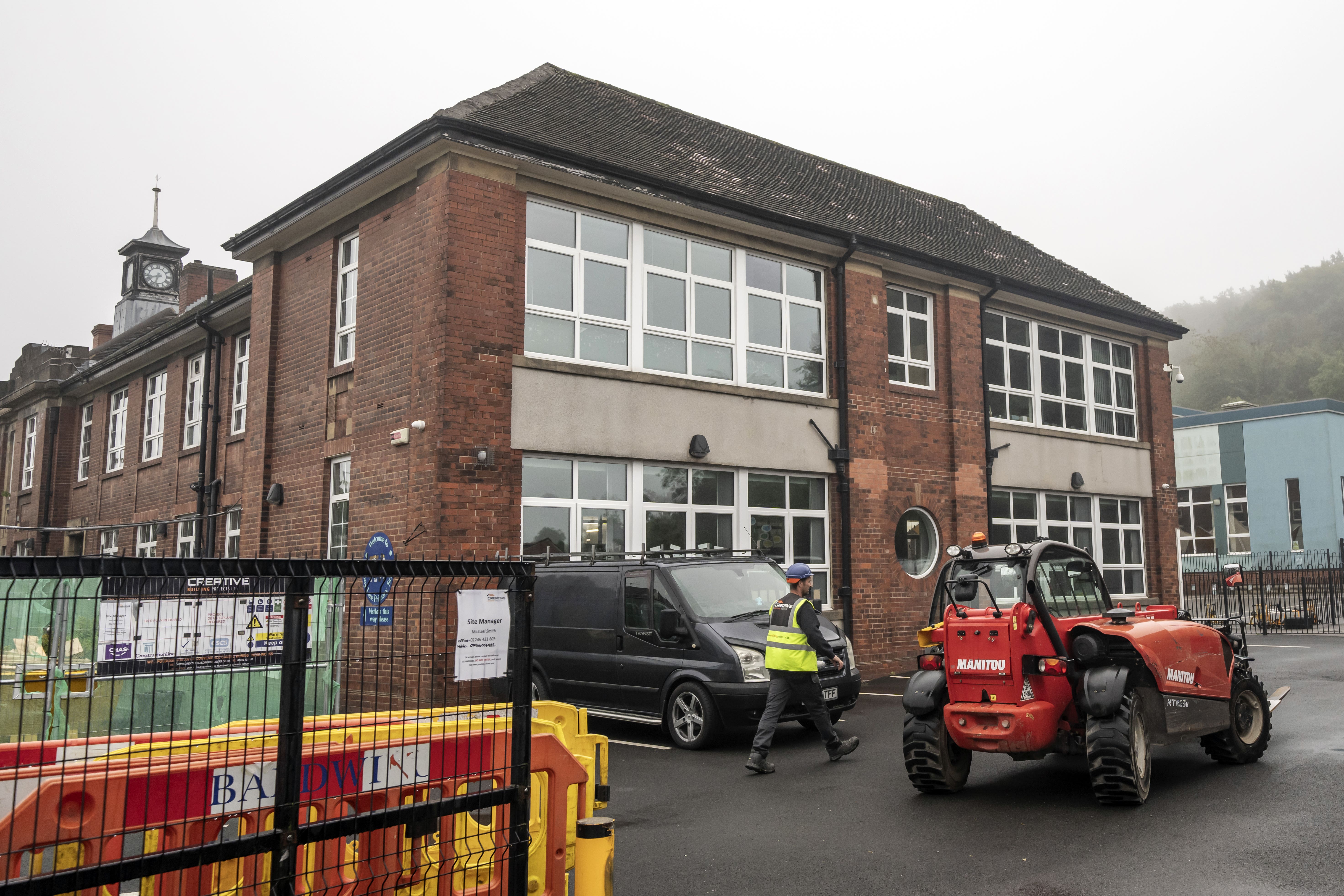 Workmen at Abbey Lane Primary School in Sheffield, which has been affected with sub-standard reinforced autoclaved aerated concrete (Raac) (Danny Lawson/PA)