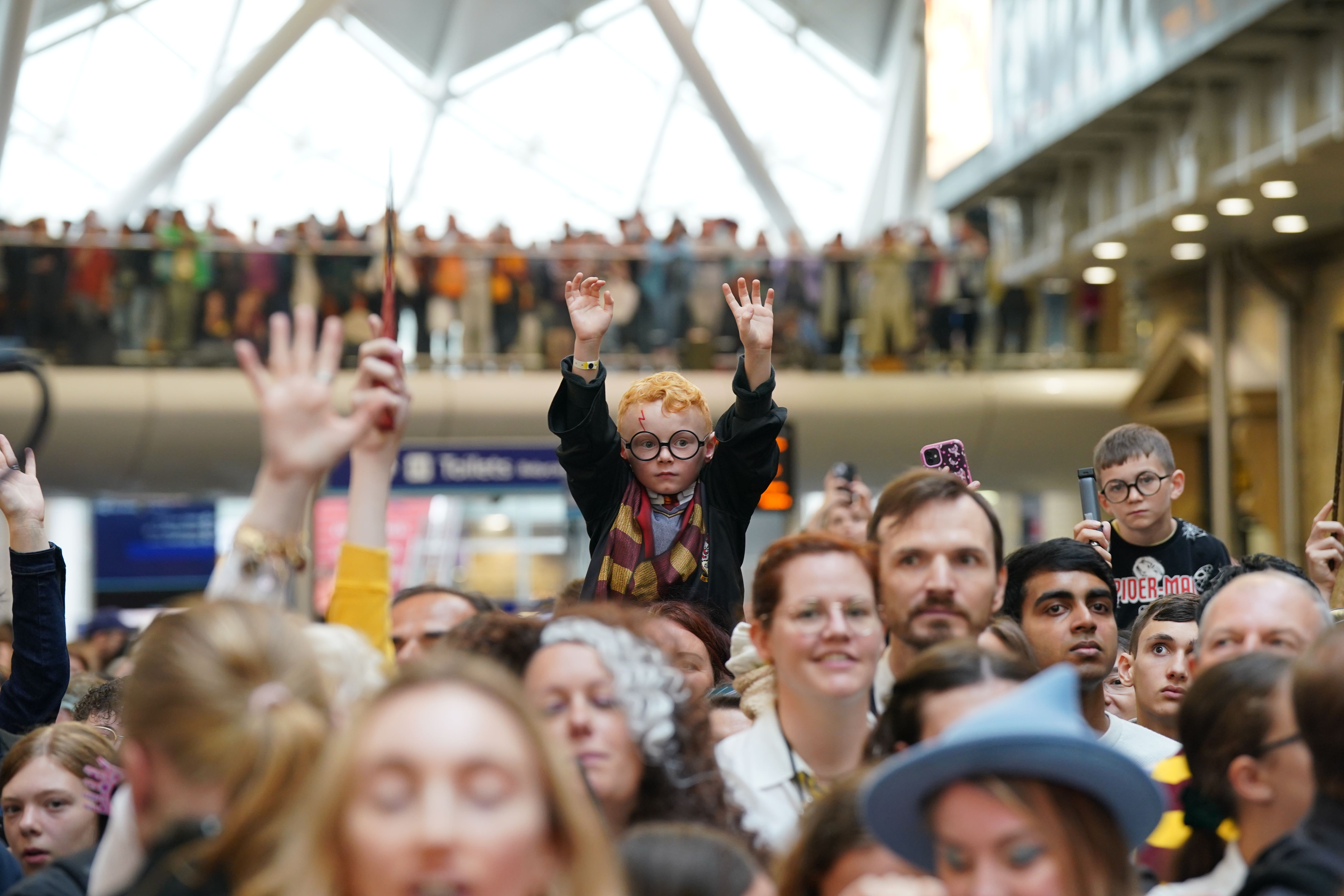 Harry Potter fans of all ages gathered at Kings Cross station in London on Friday to celebrate the annual Back to Hogwarts Day (Lucy North/PA)