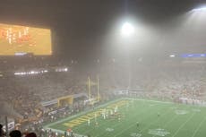 Dust storm blows through football stadium mid-game in Arizona