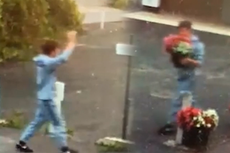 Thief waves at CCTV while stealing flower display from family business