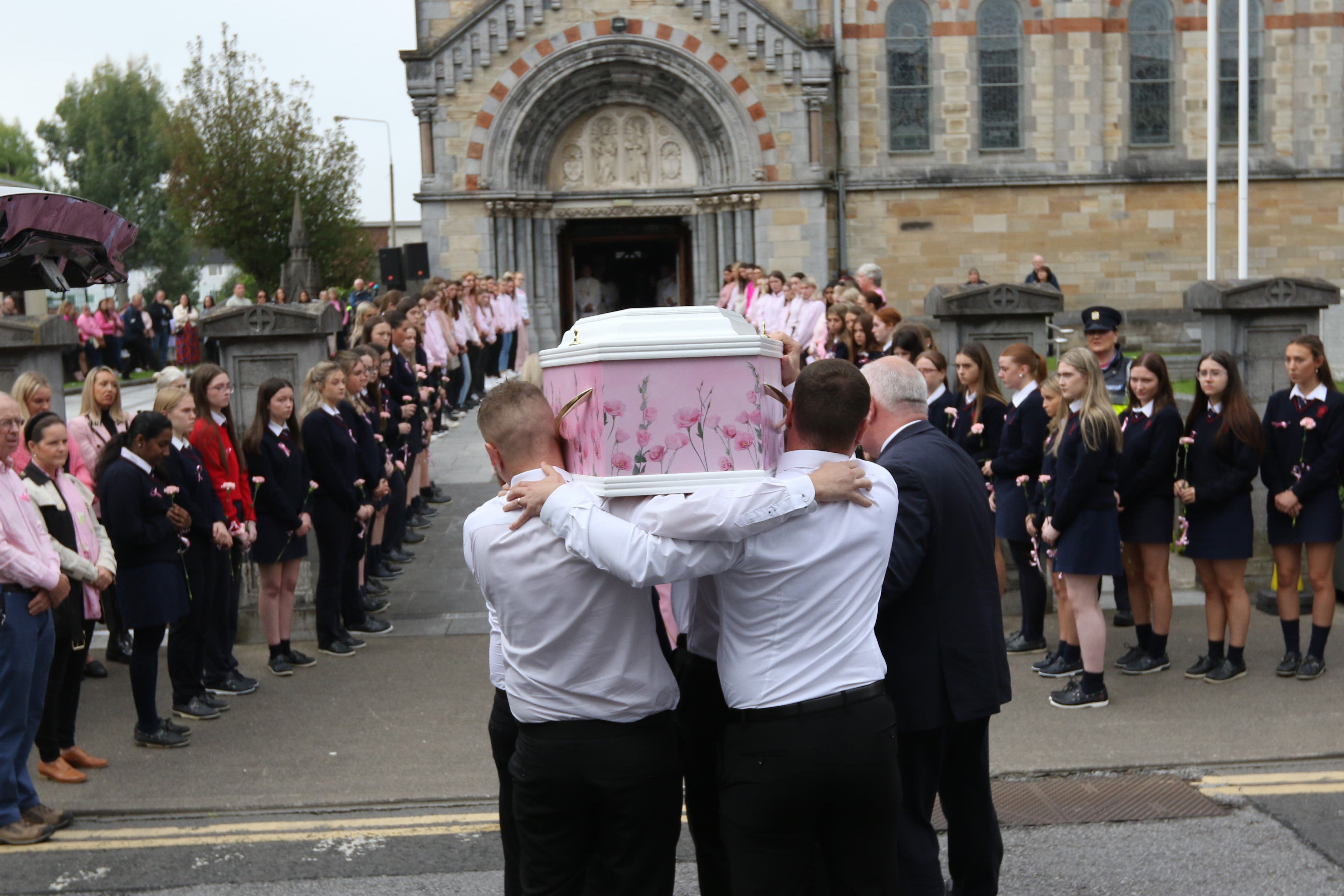 The coffin of crash victim, Zoey Coffey, 18, is carried into Saints Peter and Paul’s Church in Clonmel (Brendan Gleeson/PA)