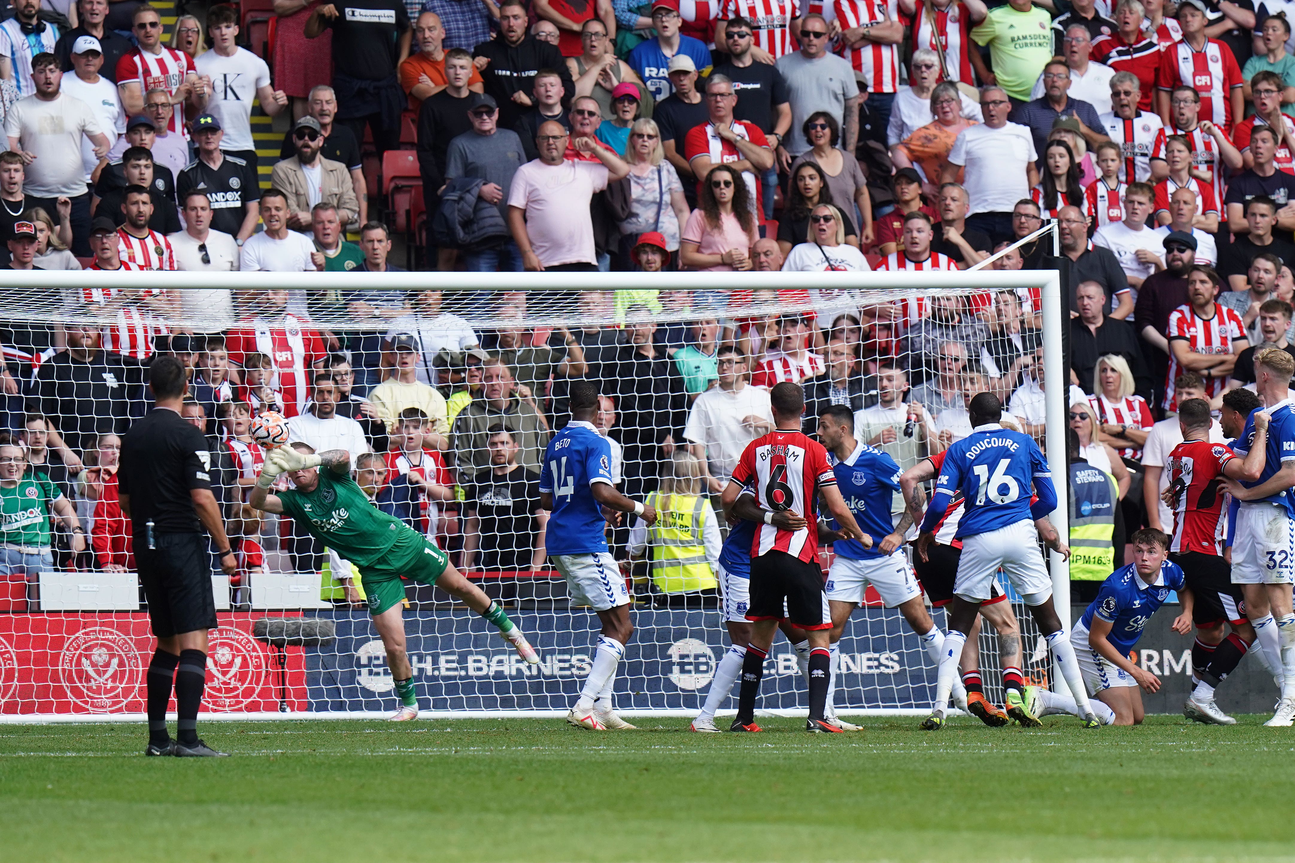 Everton goalkeeper Jordan Pickford makes a save late in the game (Danny Lawson/PA)