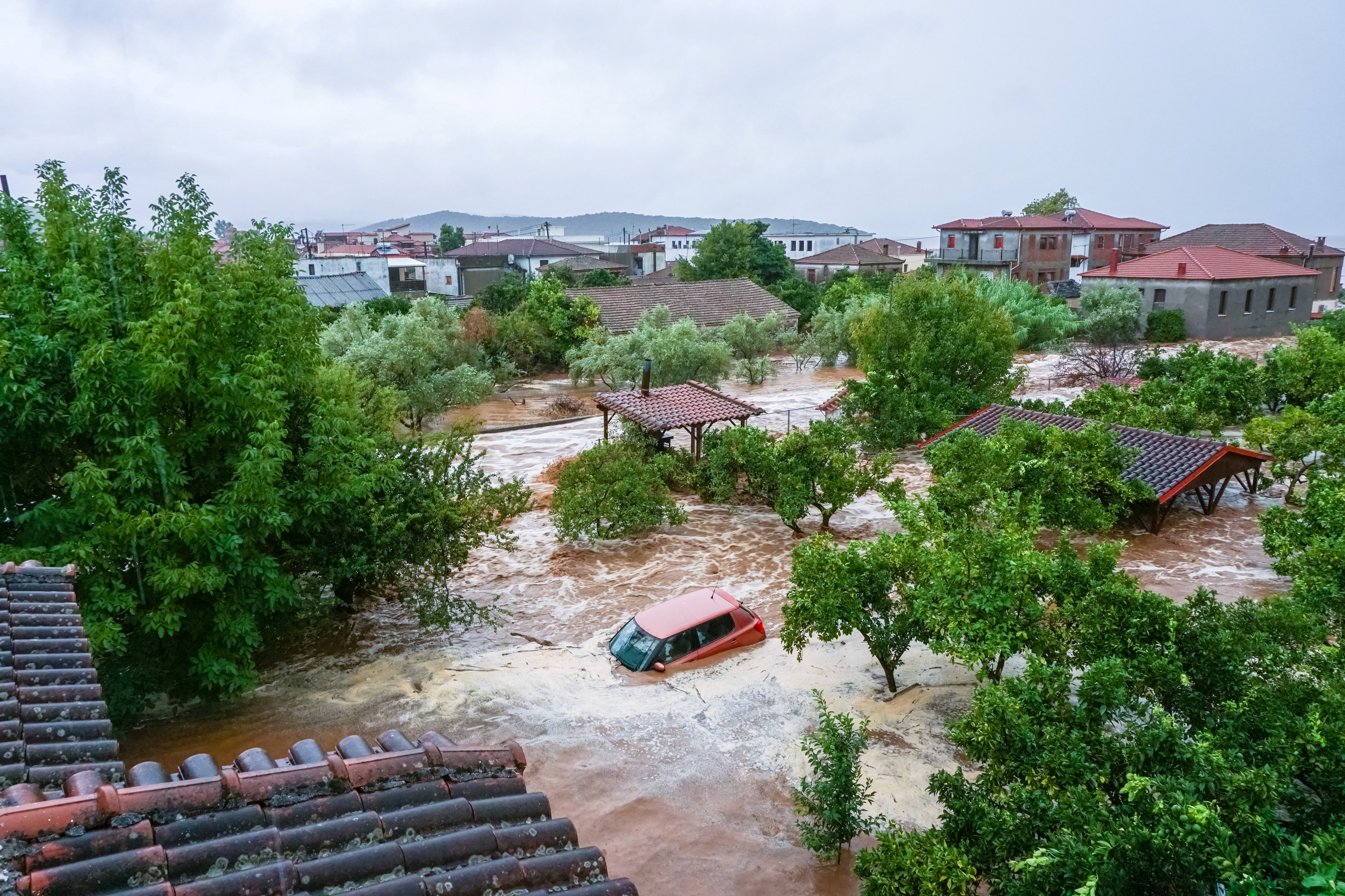 A car is submerged under water during a storm on mount Pelion, near Volos, Greece