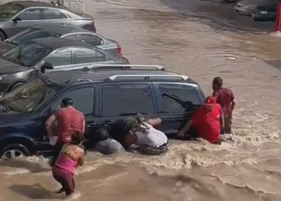 Cell phone footage shows the dramatic moments when nearby residents attempt to rescue the teen