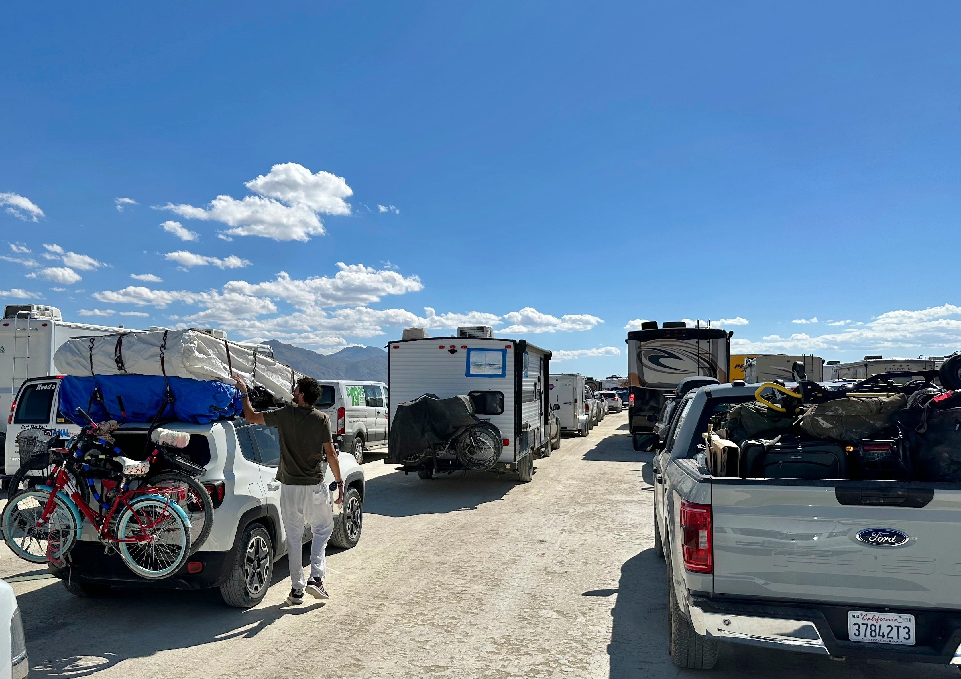 People leave the Burning Man festival on Tuesday Sept. 5, 2023 in Reno, Nevada