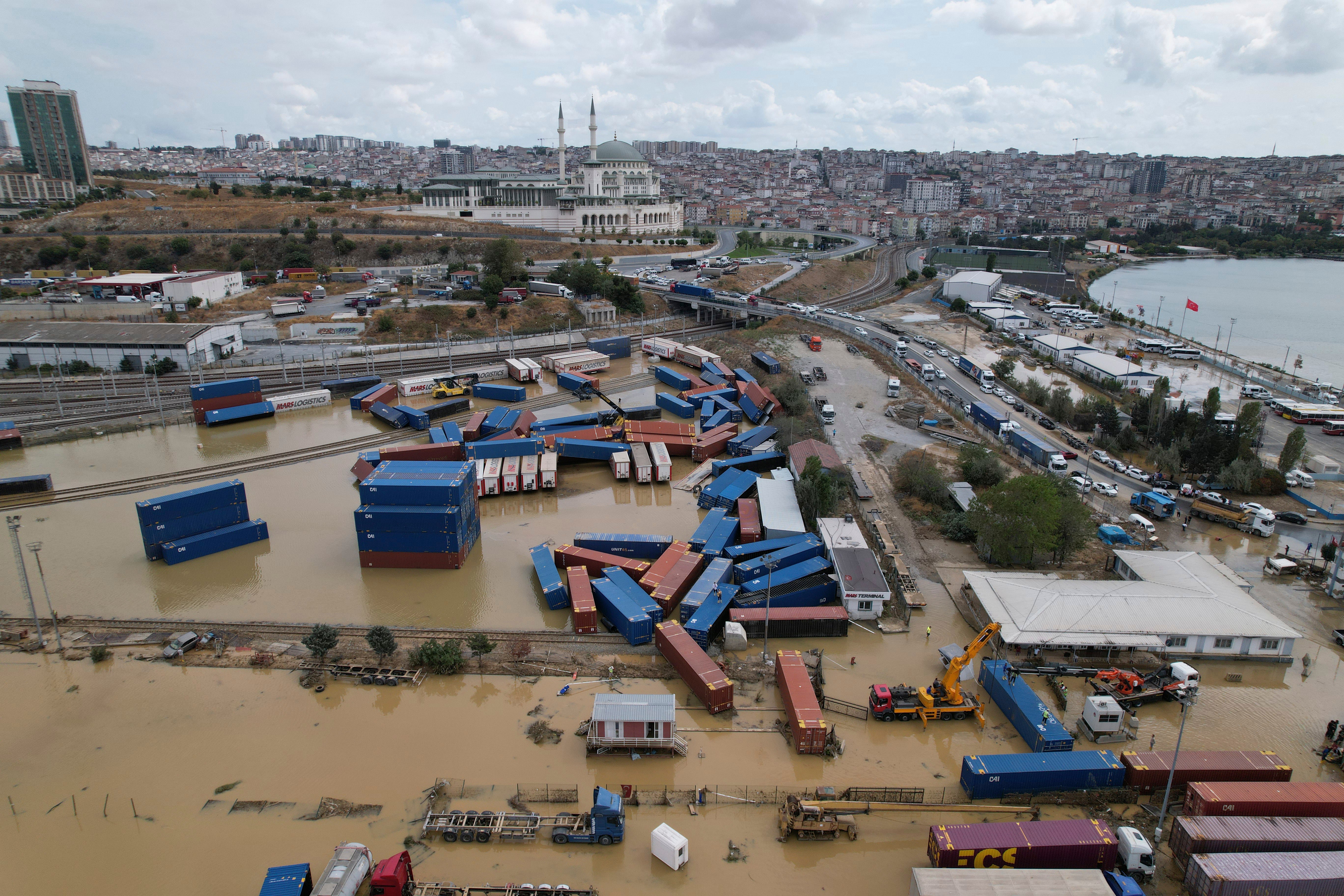 Containers are scattered near a train station on the aftermath of floods caused by heavy rains in Istanbul