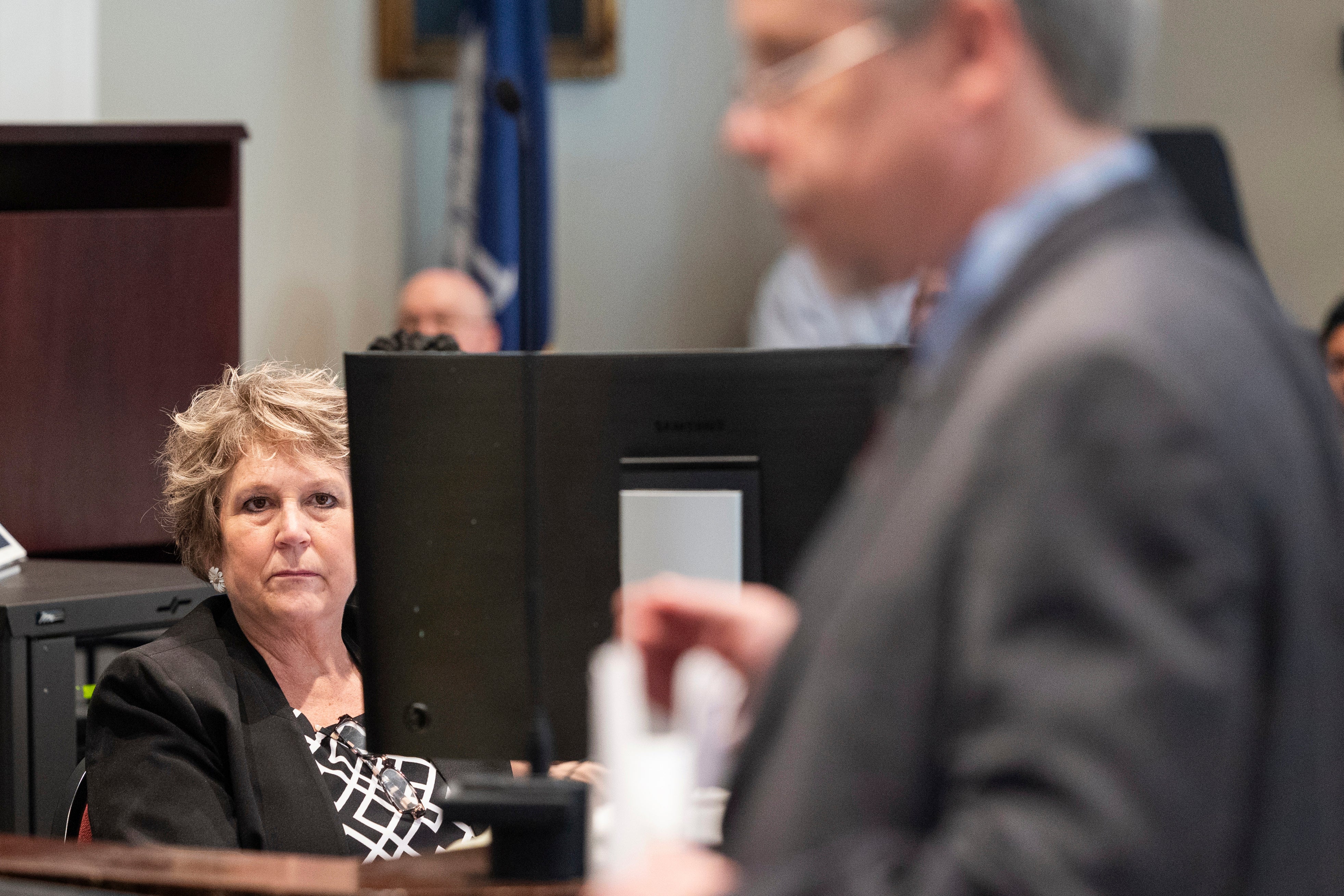 Colleton County Clerk of Court Rebecca Hill listens as Prosecutor Creighton Waters makes closing arguments in Alex Murdaugh trial