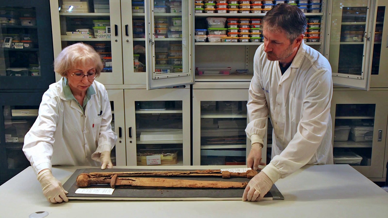 Conservators Ilan Naor and Lena Kupershmidt with the swords