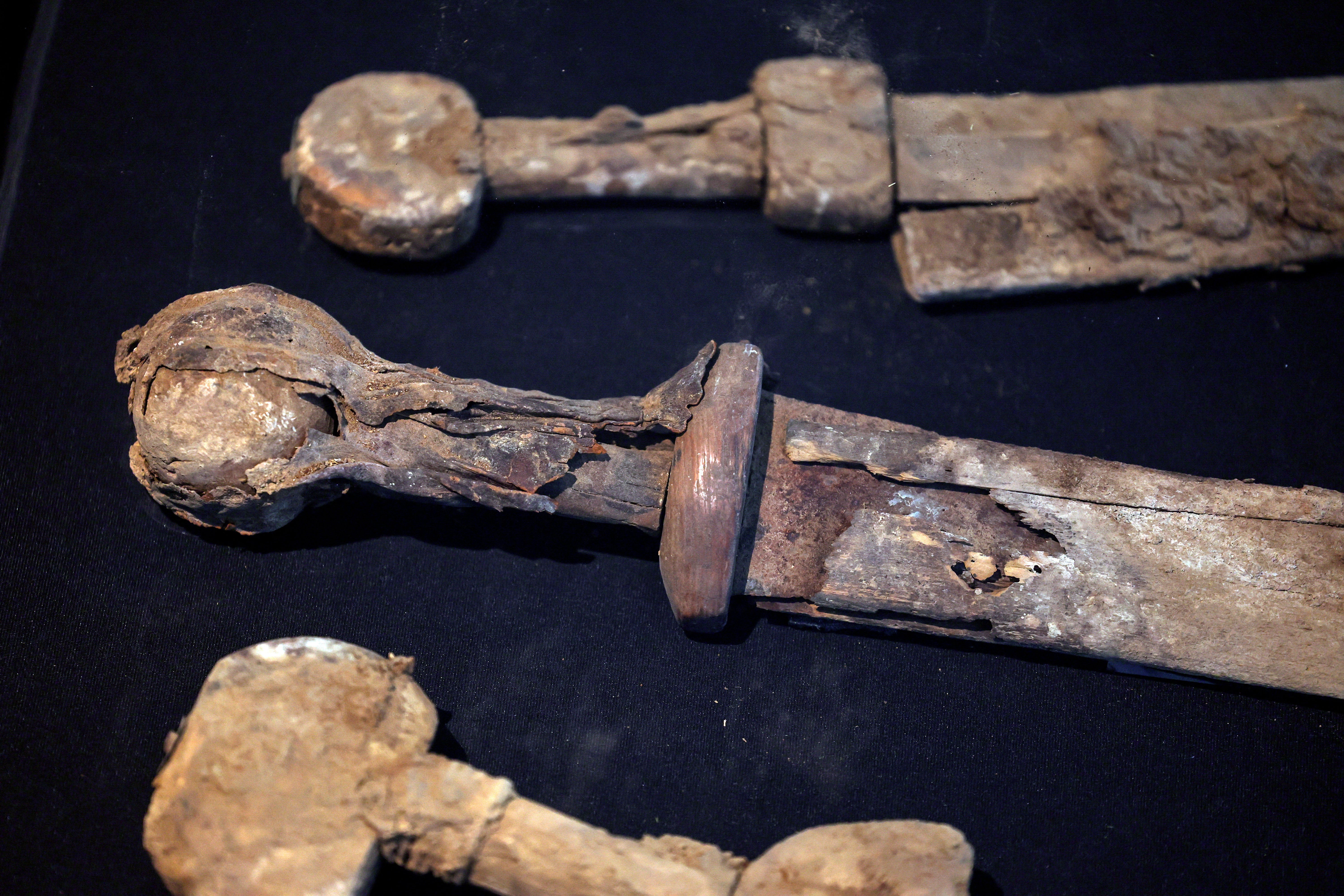 Ancient swords, believed by the Israel Antiquities Authority to be from the Roman era dating back 1,900 years and found in a weapons cache in a cave in an Israeli desert, are displayed in Jerusalem