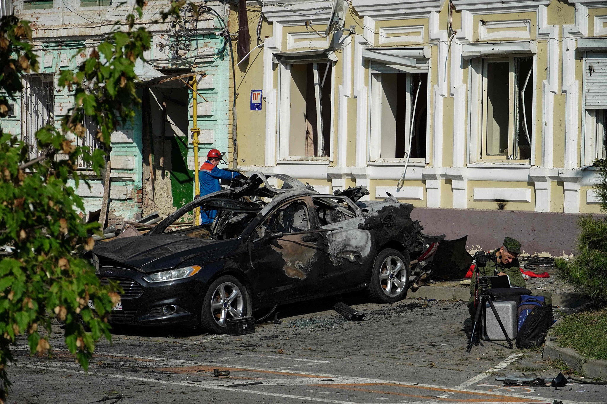 An investigator works at the site where a suspected Ukrainian drone was downed by Russian air defence systems, in central Rostov-on-Don, on 7 September