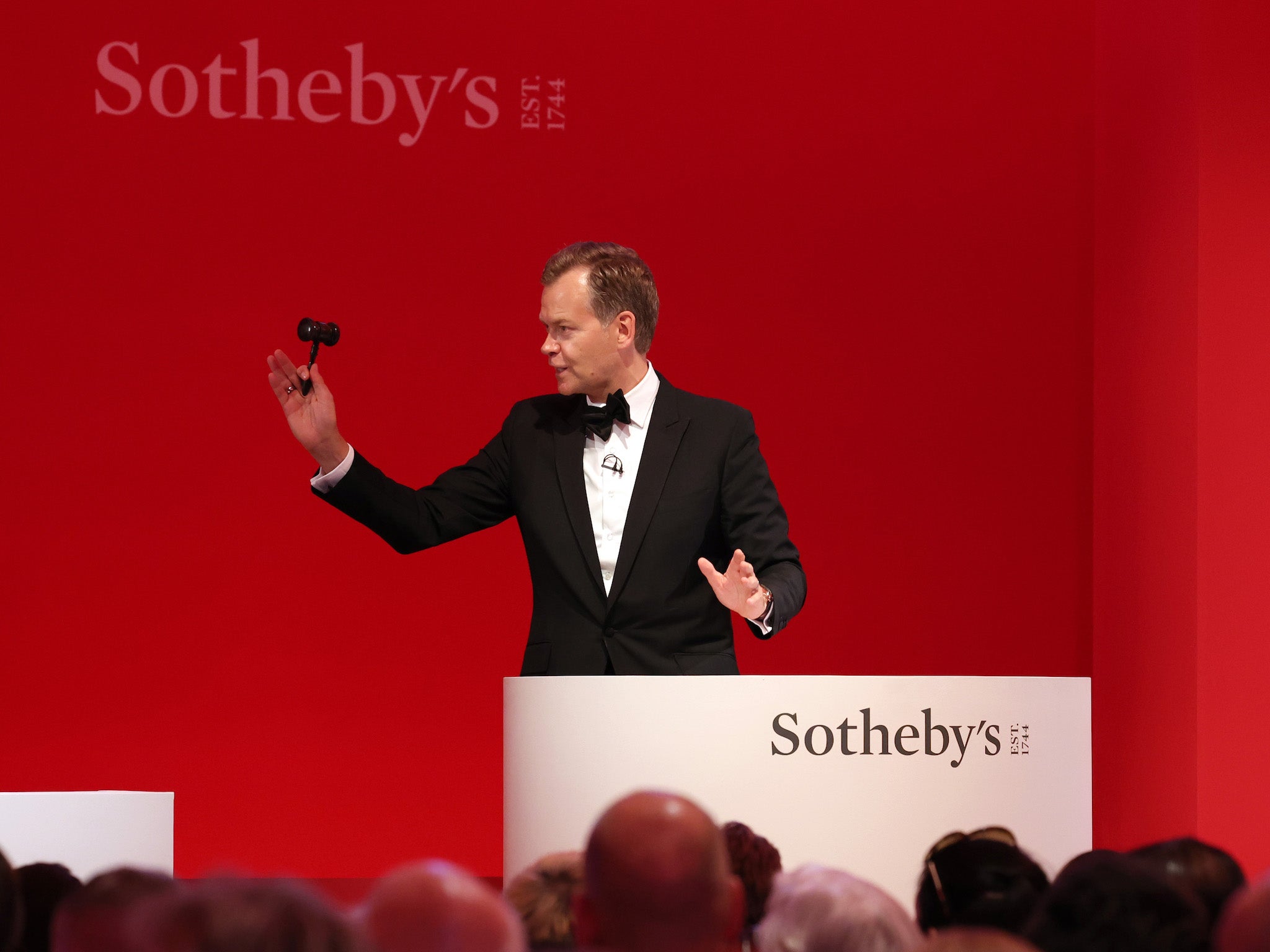 Sotheby’s principal auctioneer Oliver Barker in action