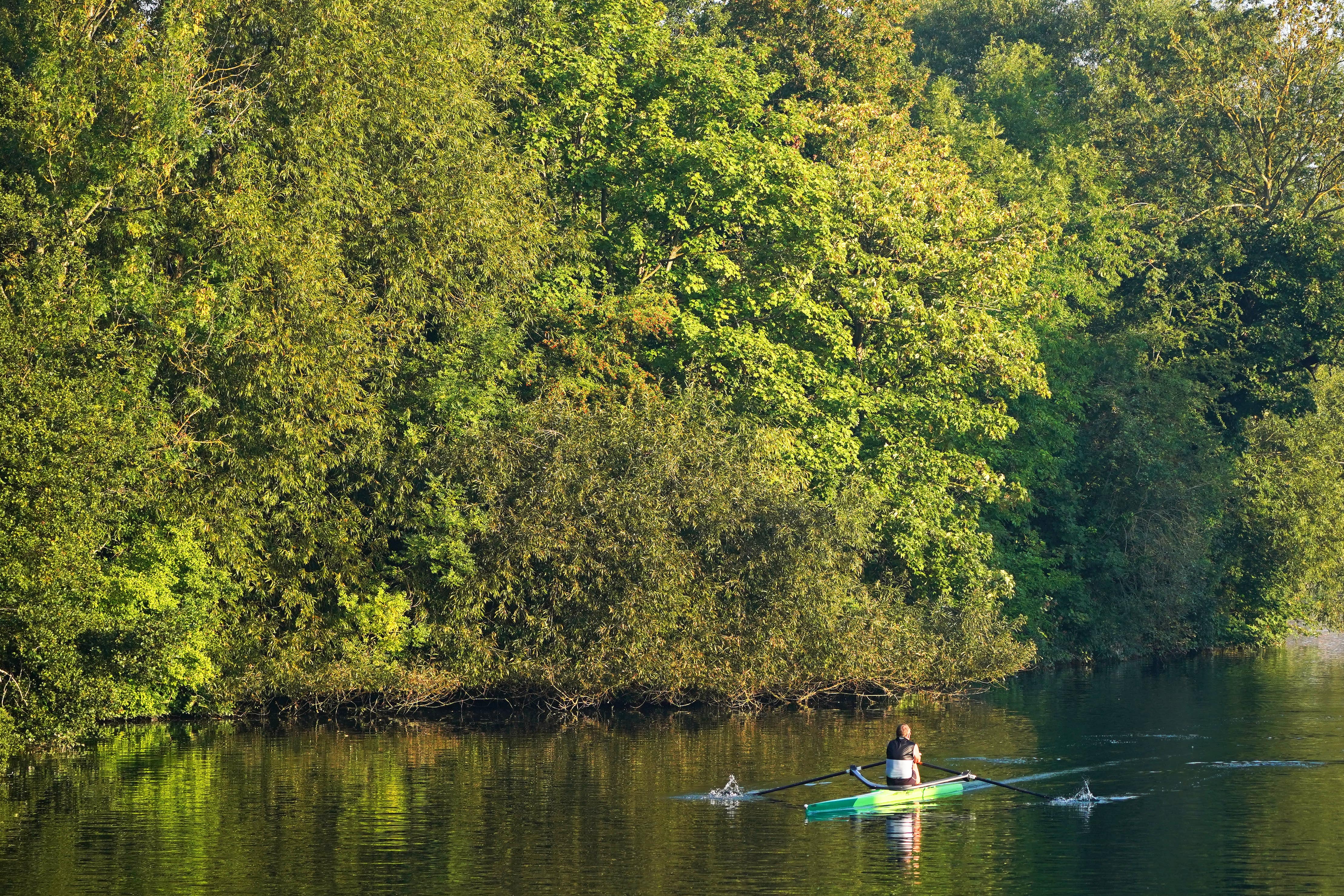 Rowers travel along the River Thames near Maidenhead, Berkshire (Jonathan Brady/PA)