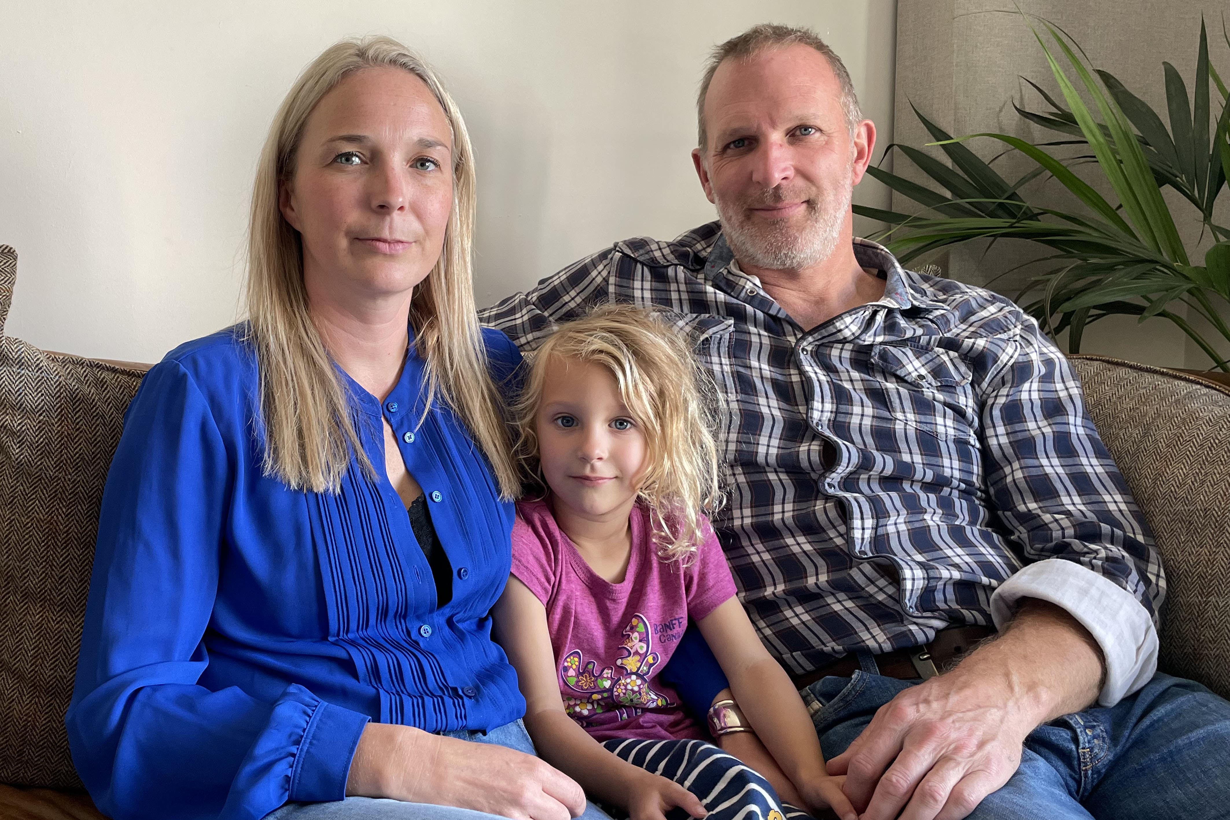 Dr Jack and Sarah Hawkins and their daughter Lottie at home in Nottingham (Callum Parke/PA)