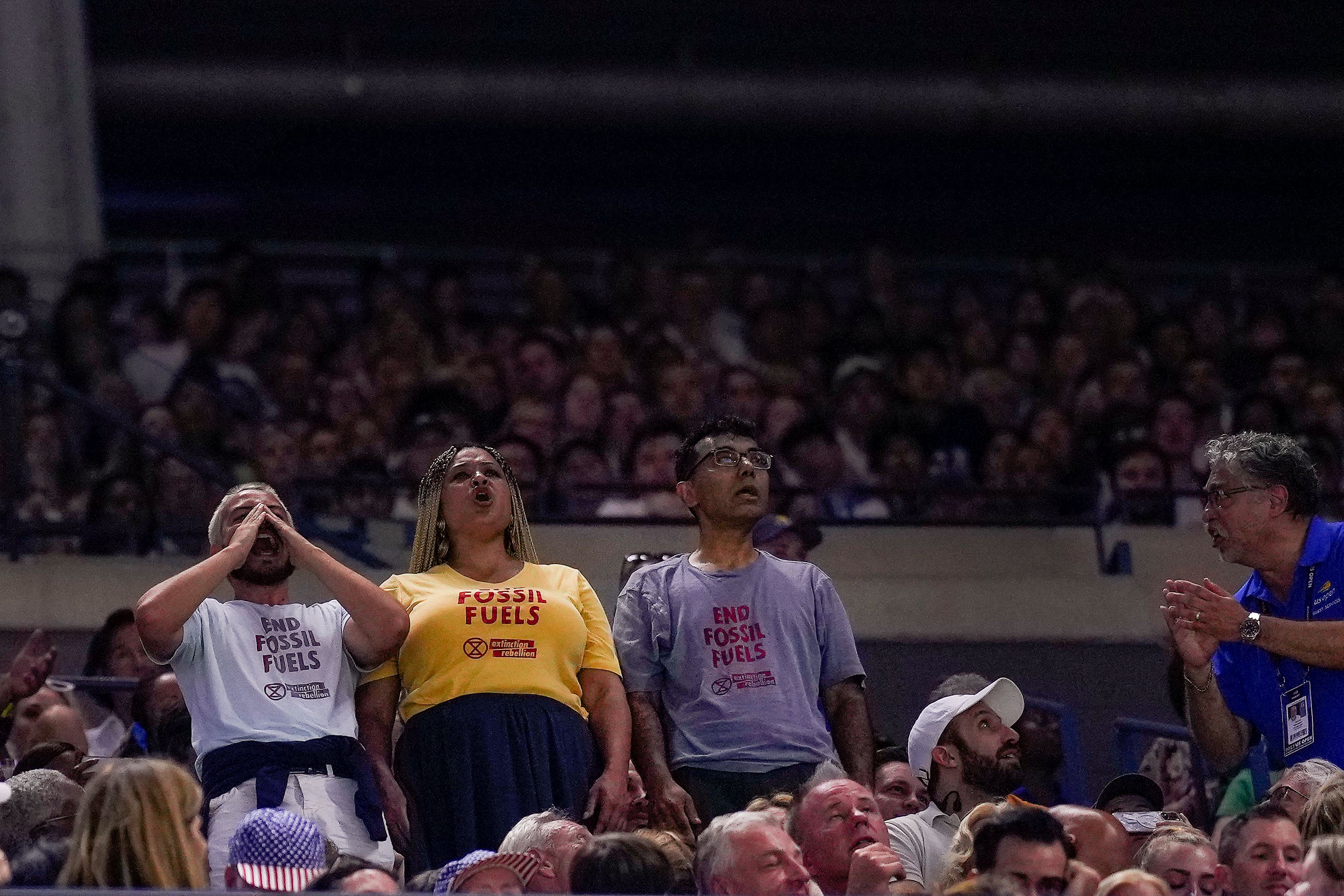 Protesters disrupt play between Coco Gauff and Karolina Muchova (Manu Fernandez/AP)