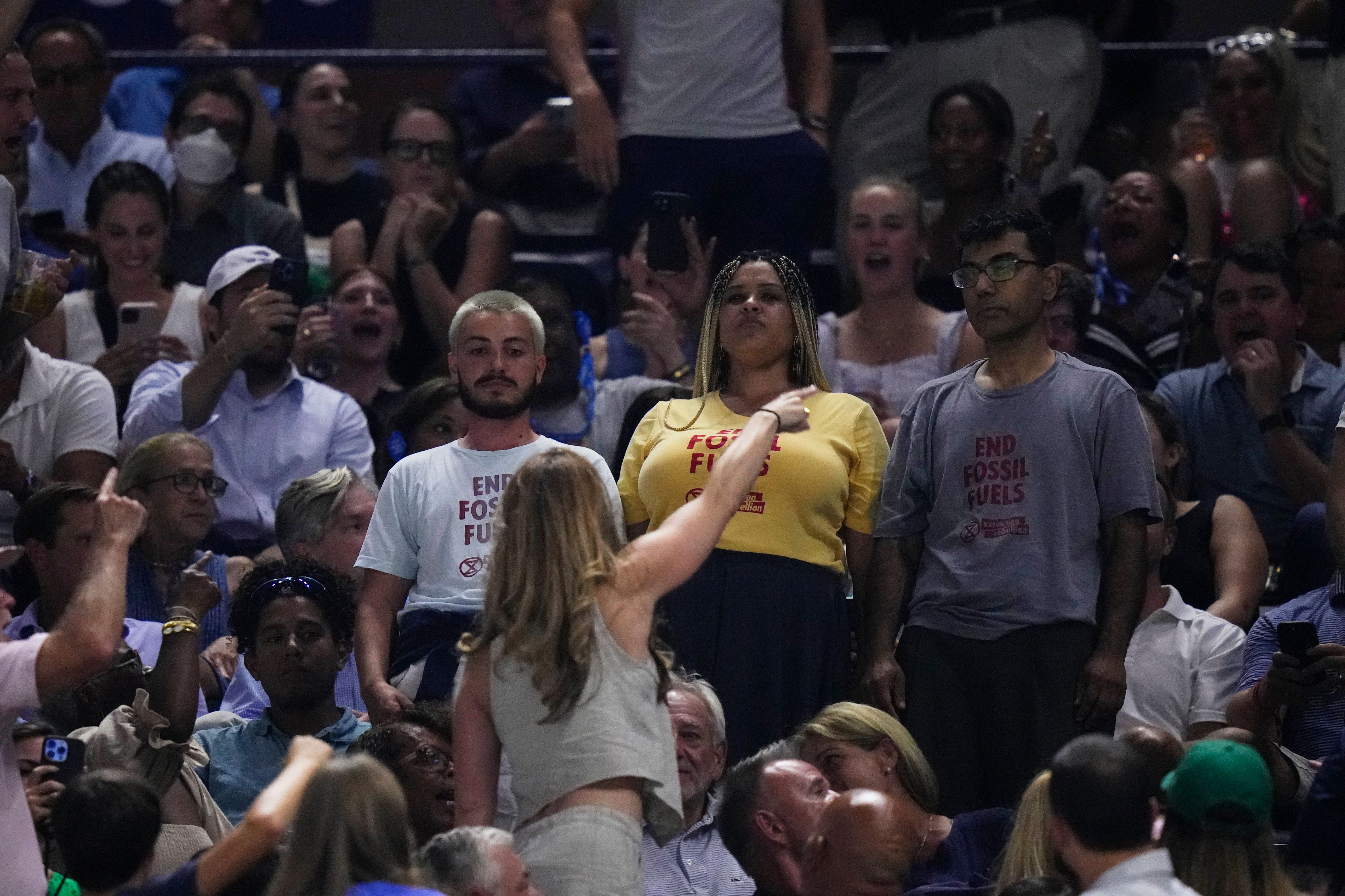 An audience member yells at protesters (Frank Franklin II/AP)