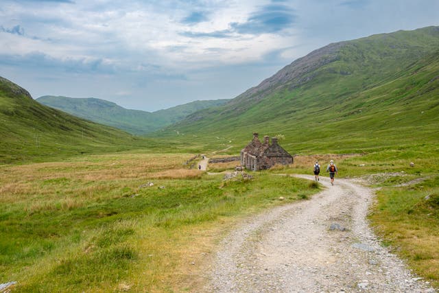 <p>Walkers on the West Highland Way in Scotland</p>