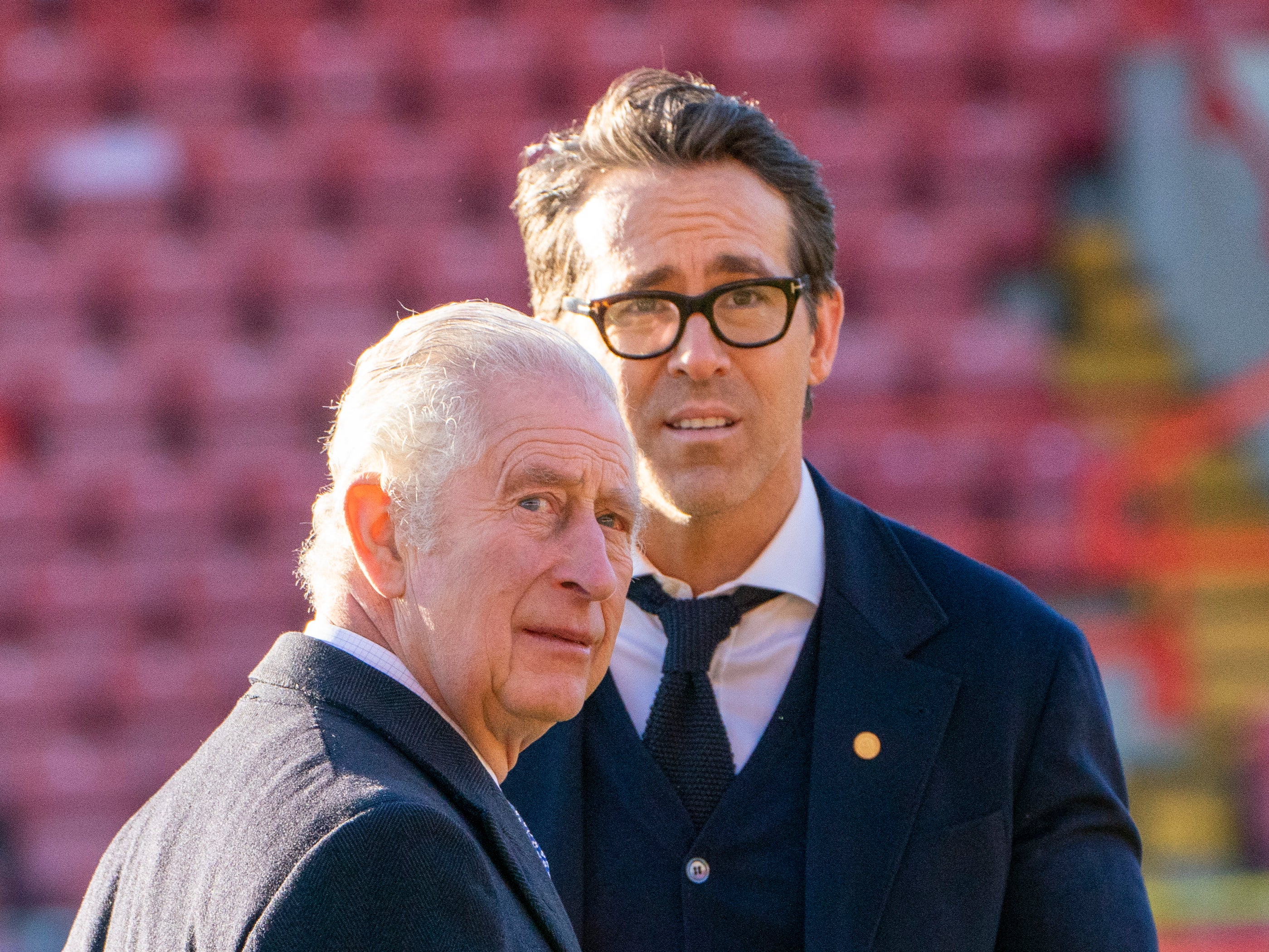 King Charles III speaks with co-owner of Wrexham AFC Ryan Reynolds