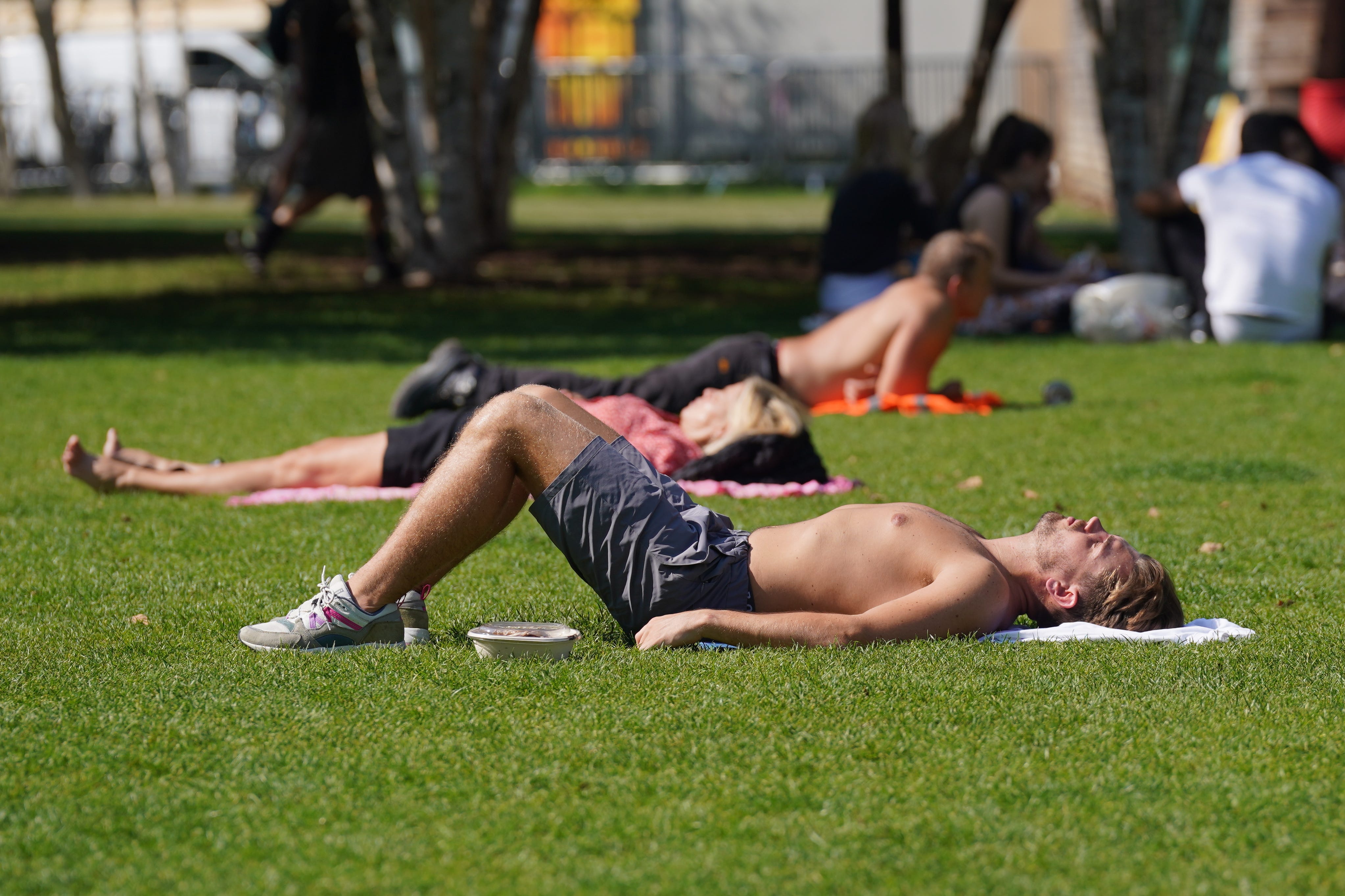 The heatwave has already broken the record for the most consecutive days with temperatures above 30C in September, with Saharan dust generating vivid sunsets and sunrises in the clear conditions (Lucy North/PA)