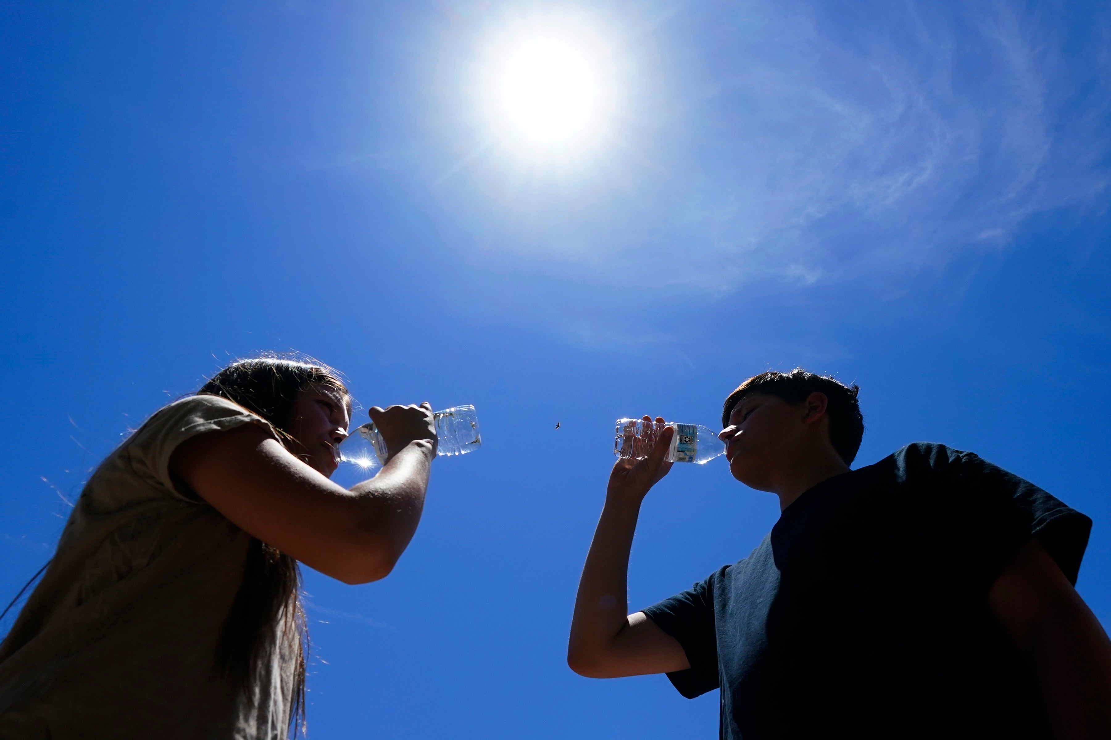 Residents of Phoenix pause for a cold drink doing July’s record-breaking heat wave