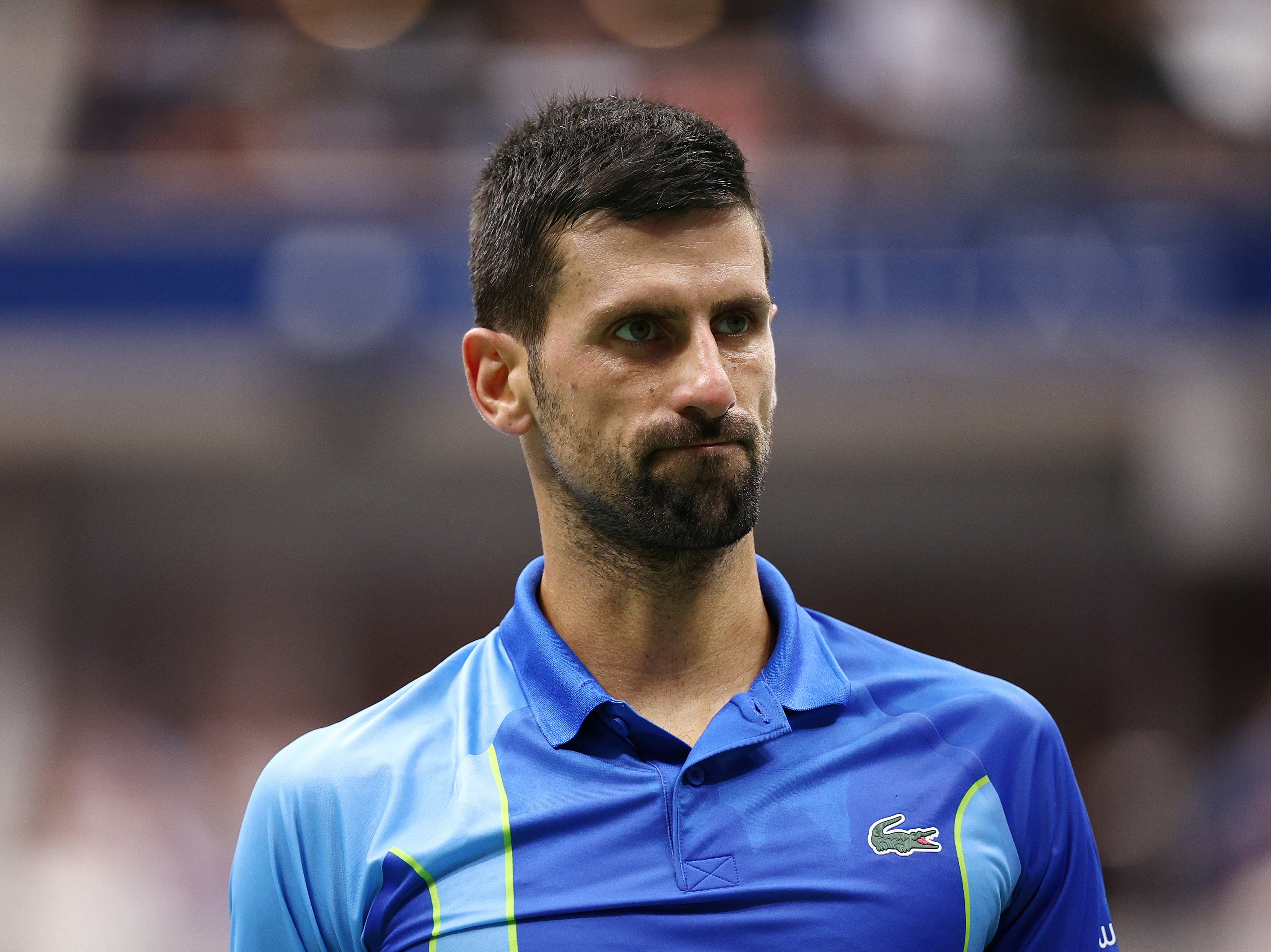 Novak Djokovic of Serbia reacts after a point against Daniil Medvedev