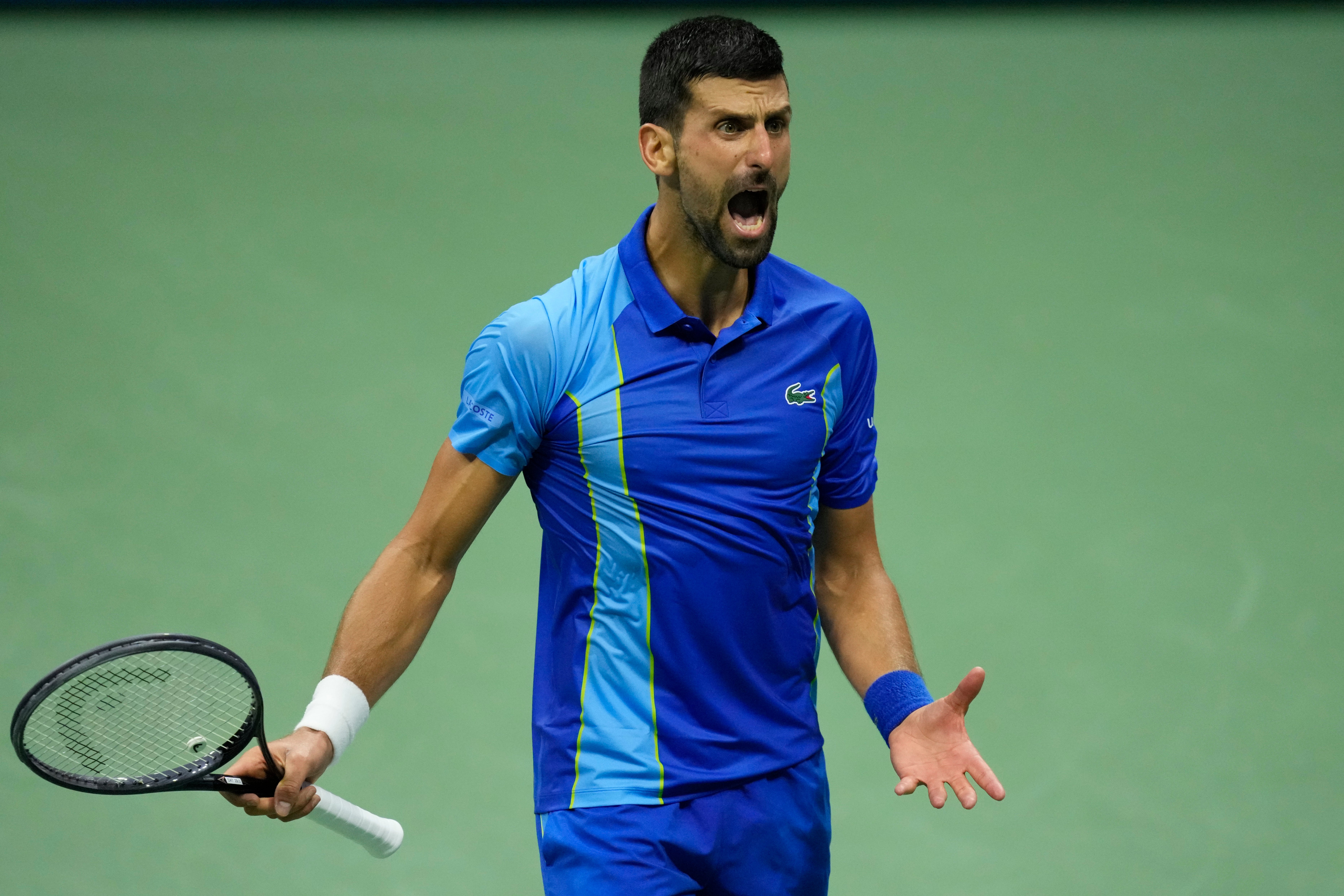 Novak Djokovic, of Serbia, reacts against Daniil Medvedev