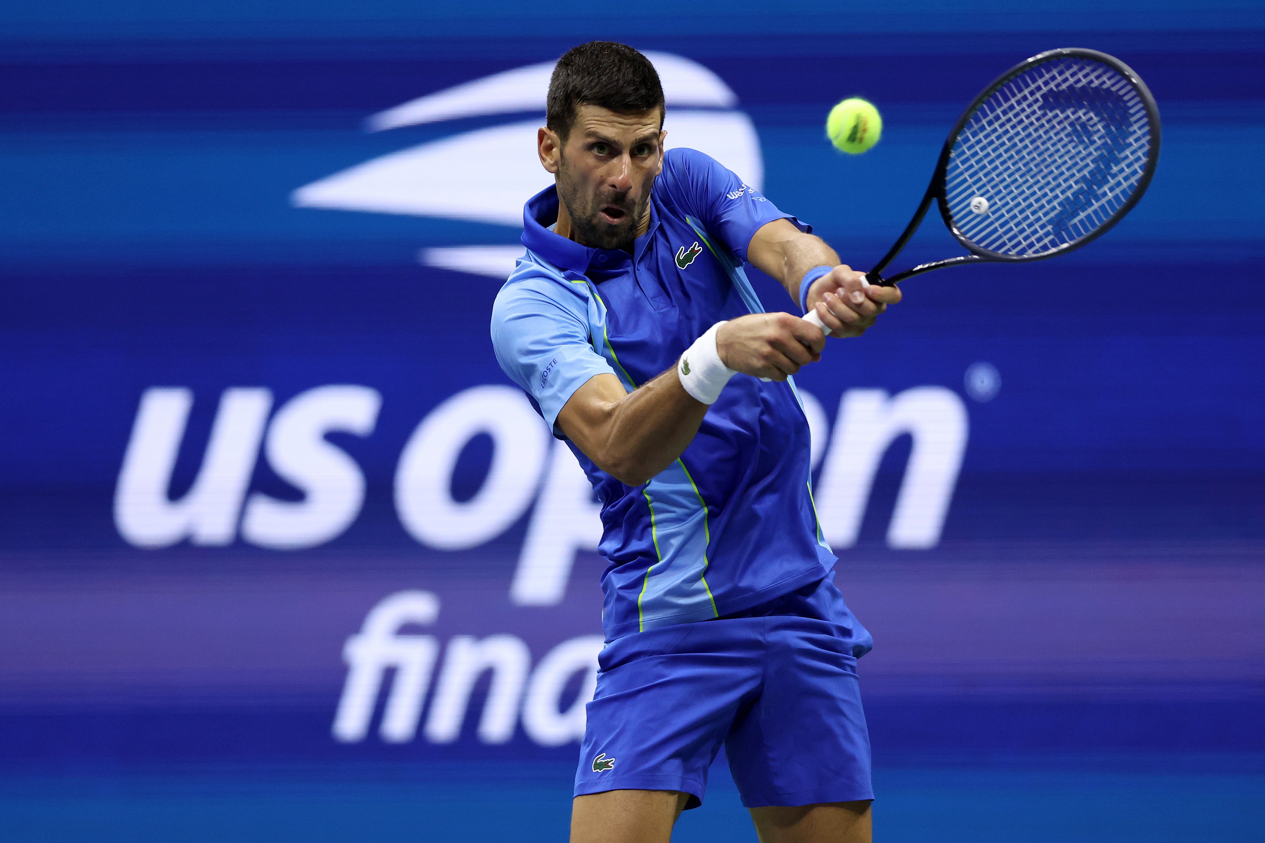 Novak Djokovic of Serbia returns a shot against Daniil Medvedev of Russia