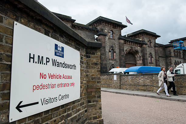 Two women walk out of the entrance to Wandsworth Prison