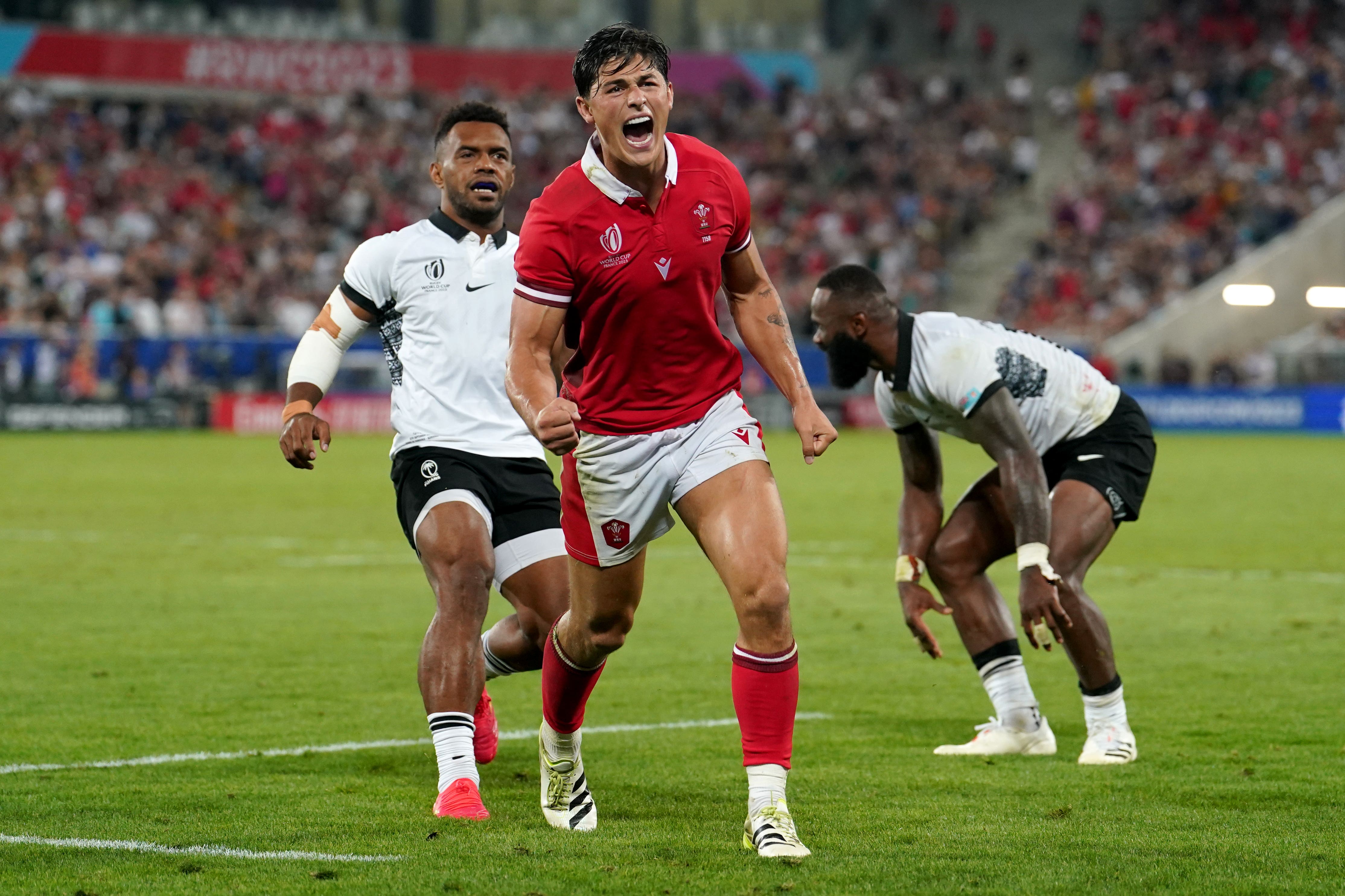 Wales wing Louis Rees-Zammit celebrates victory over Fiji (David Davies/PA)