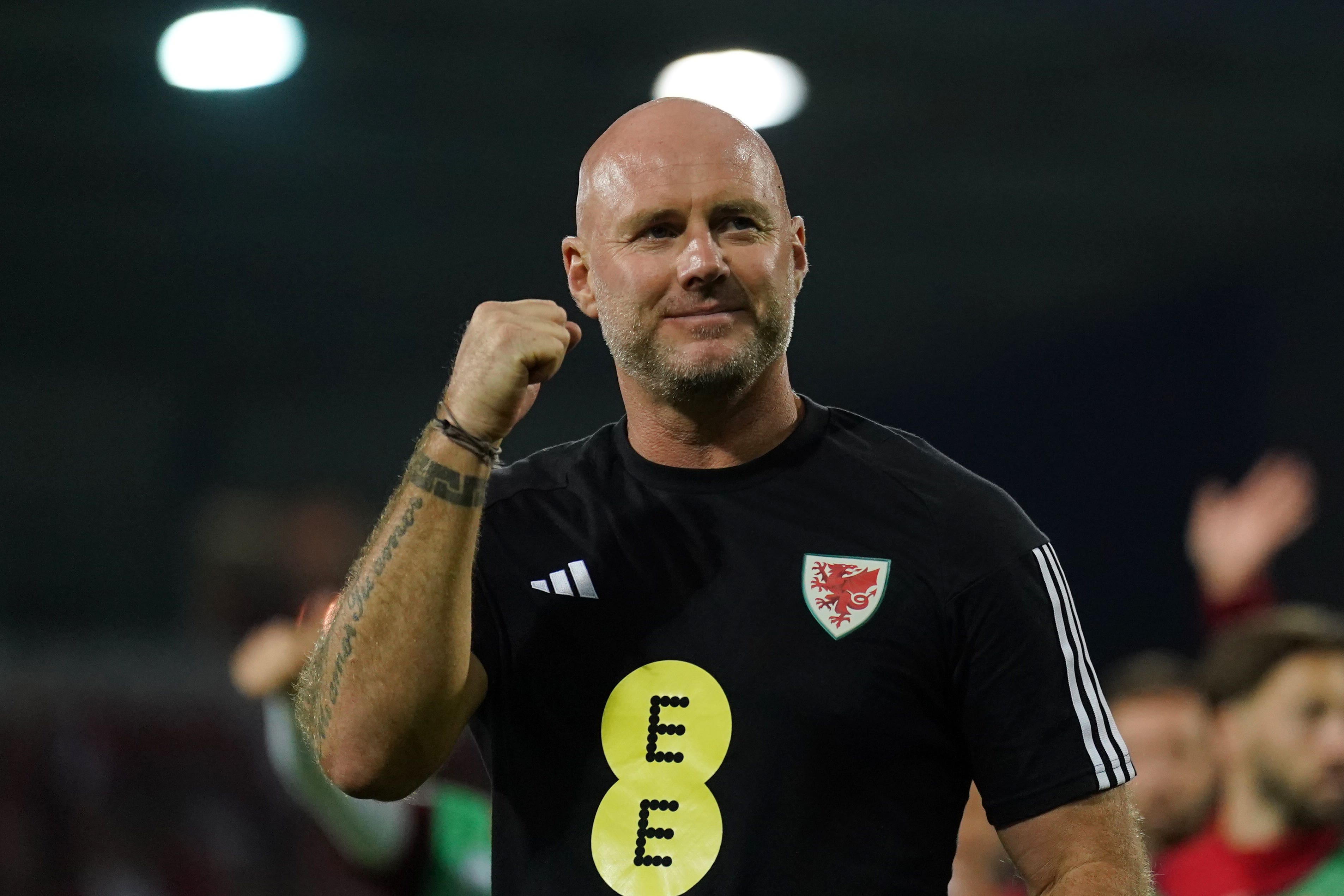 Wales manager Rob Page celebrates his side’s 2-0 win over Latvia in Riga (Tim Goode/PA)